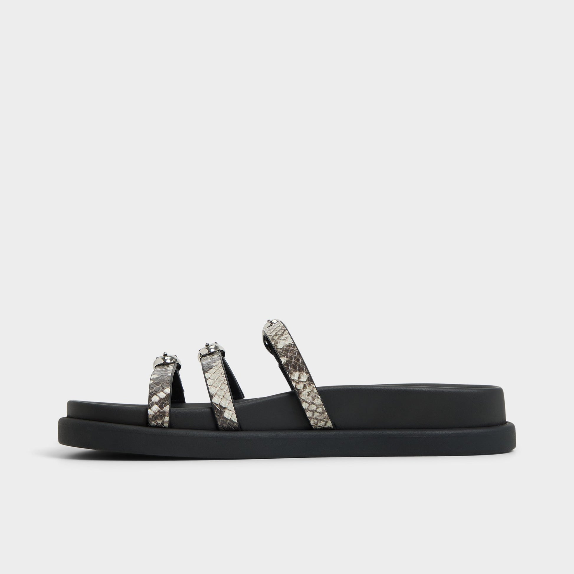 Side view of White/Black Zephyra Footbed sandal