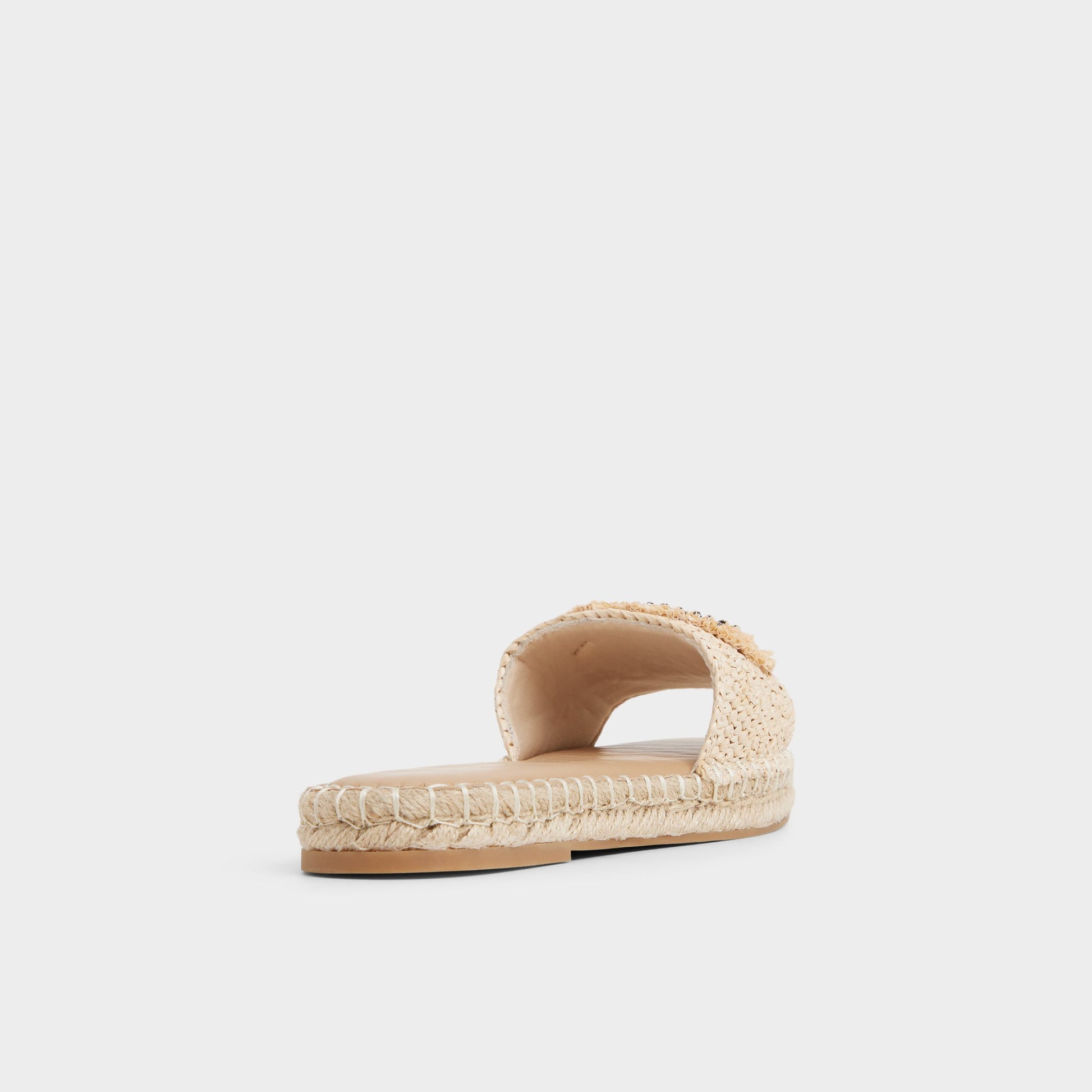 Three-quarter angle of Natural Nazar Slide sandal's back side
