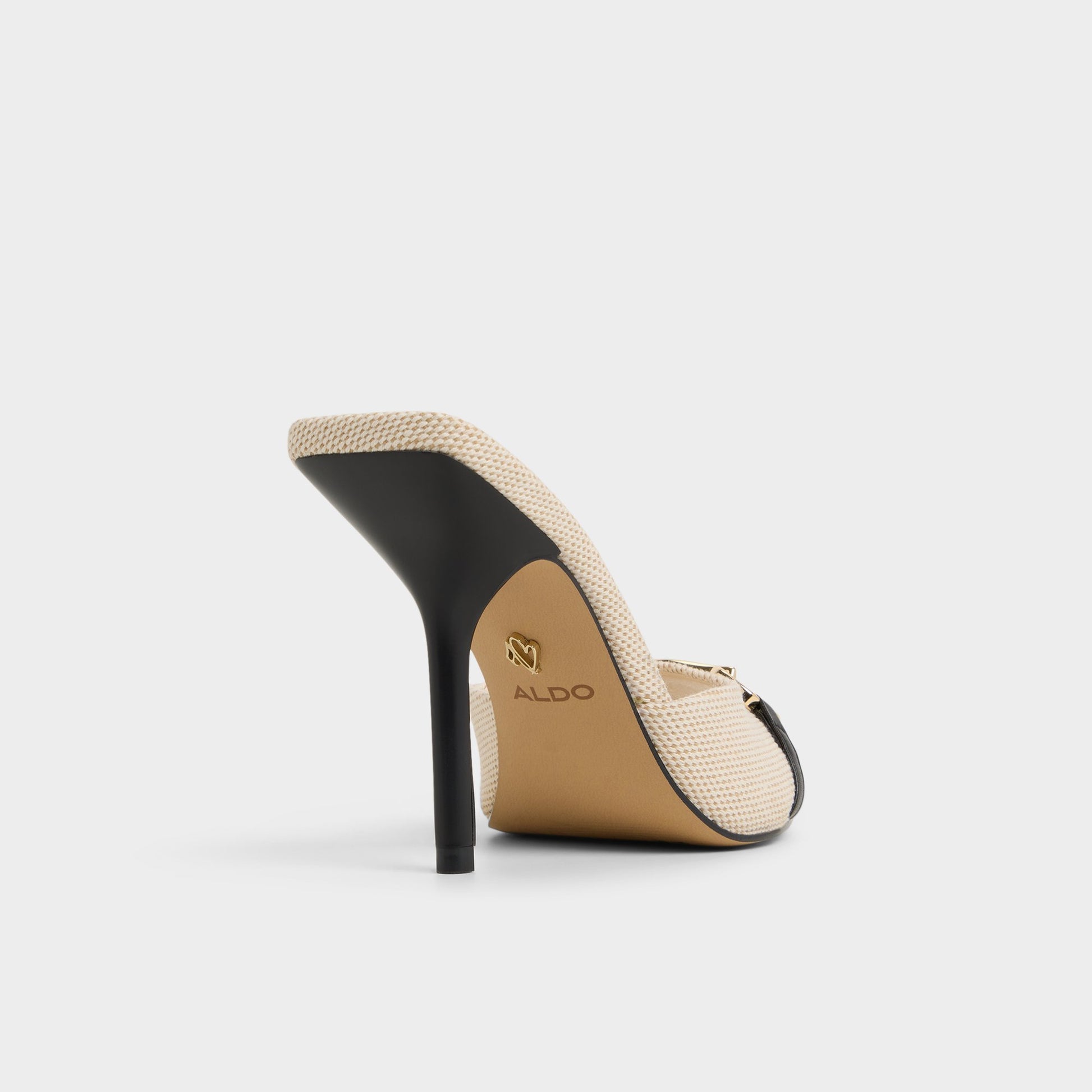 Three-quarter angle of Open Natural Madelynie Heeled mule's back side