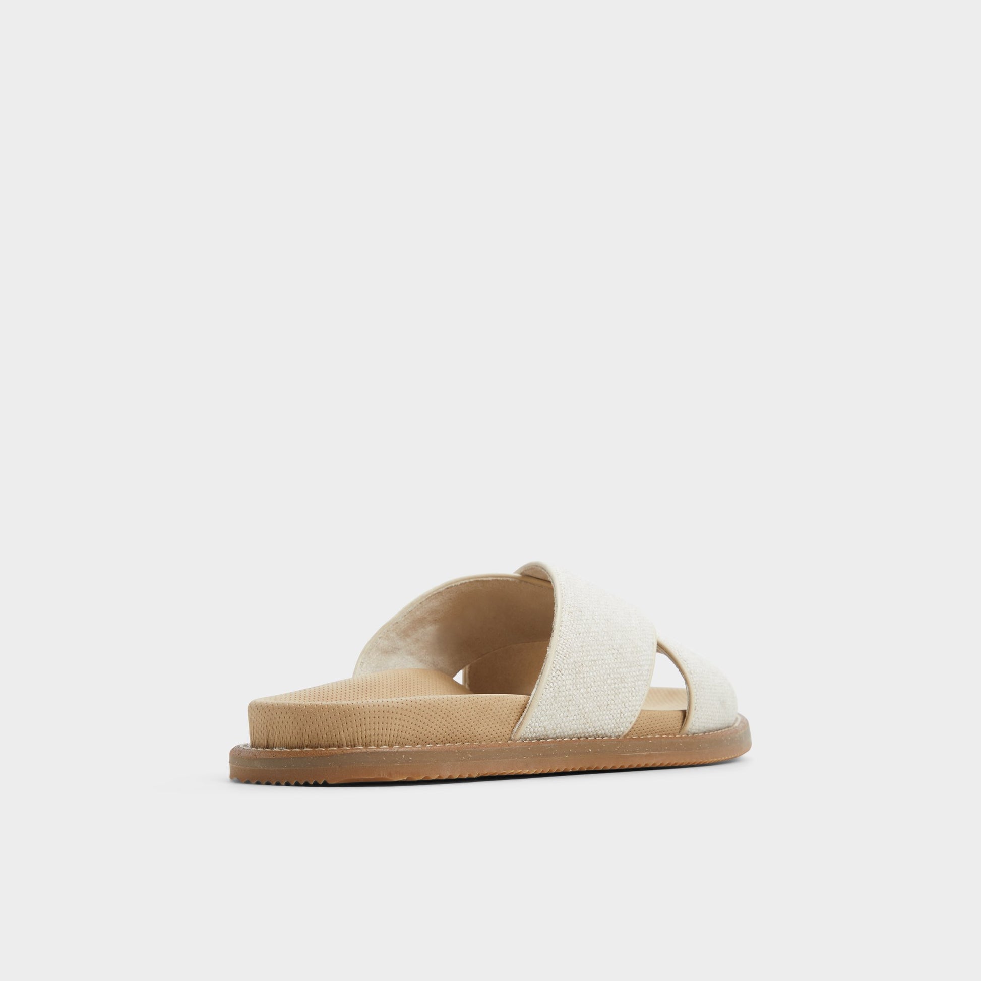 Three-quarter angle of Open Beige Marrin Slide sandal's back side