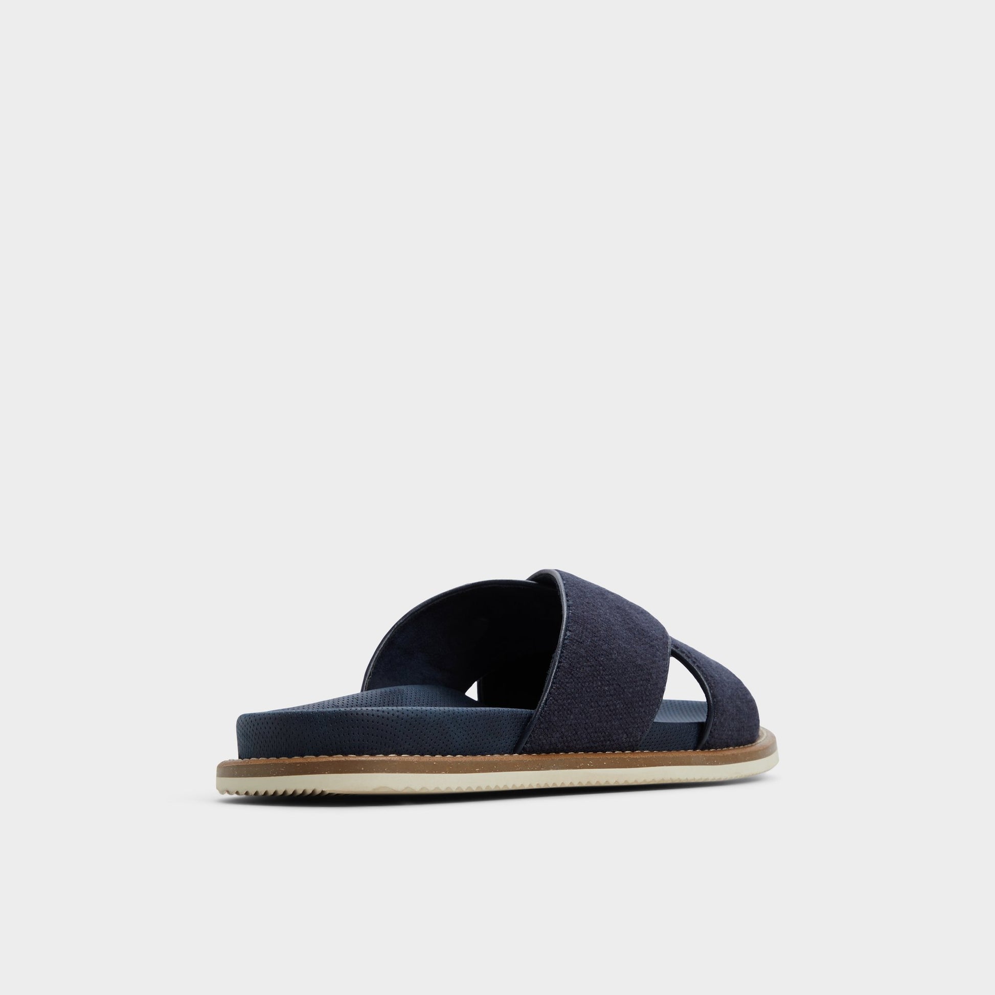 Three-quarter angle of Navy Marrin Slide sandal's back side