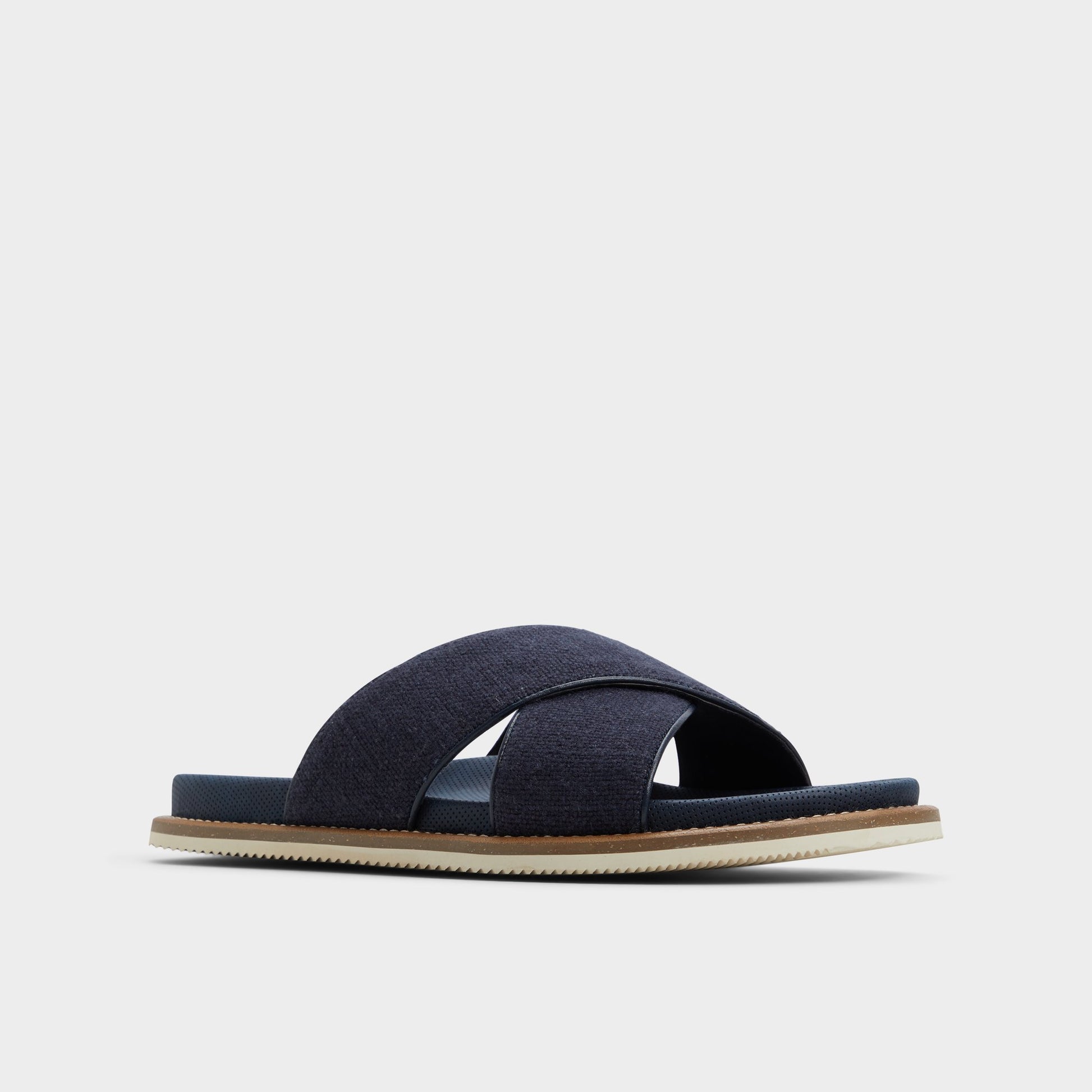 Three-quarter angle of Navy Marrin Slide sandal's front side