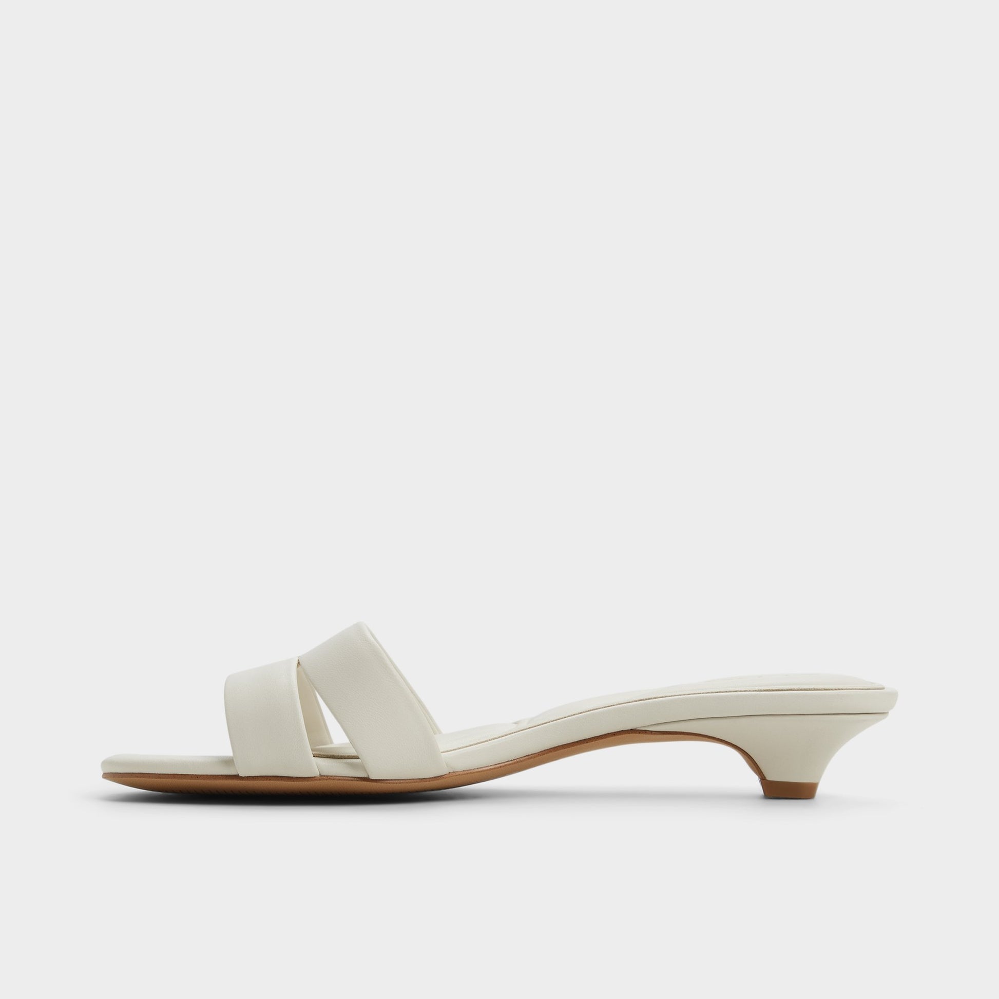 Side view of White/Bone Scarletta Heeled mule