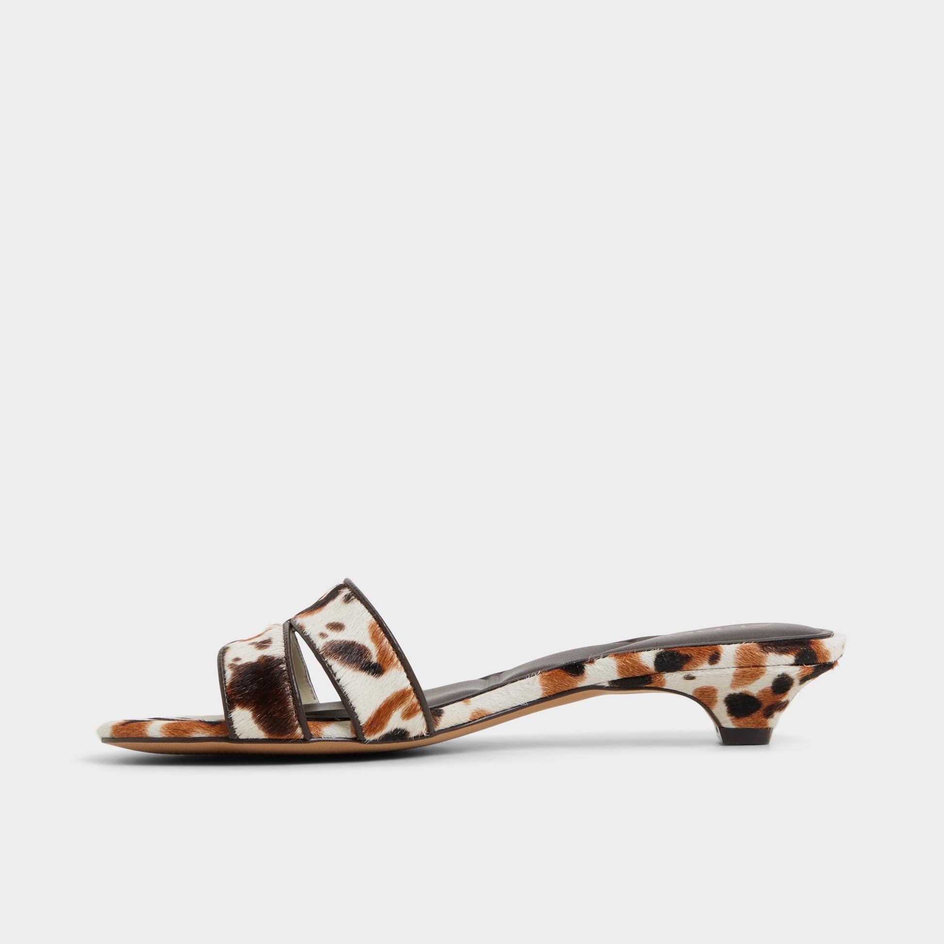 Side view of White/Black Scarletta Heeled mule