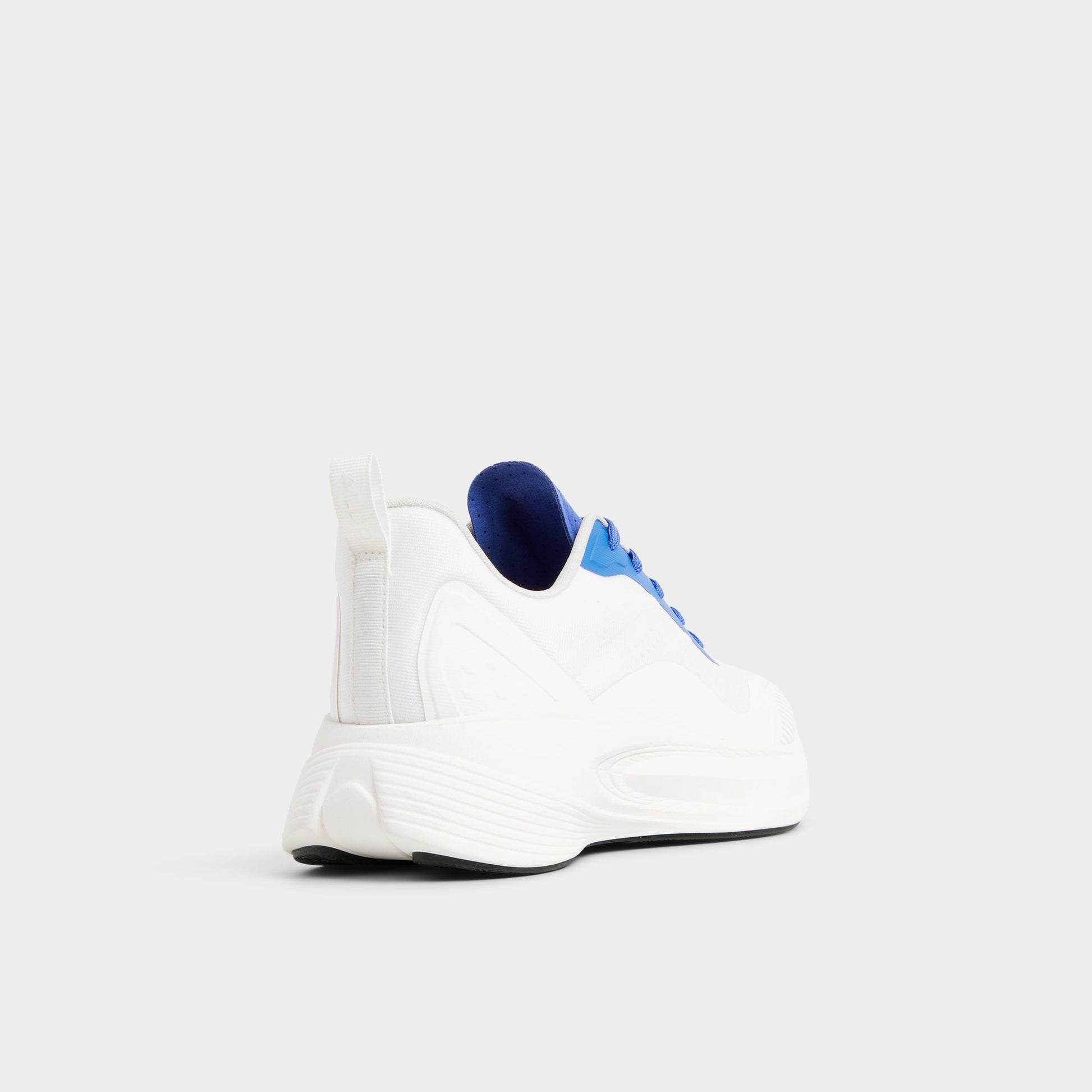 Three-quarter angle of White/Blue Pillowsnkr-m Jogger sneaker's back side