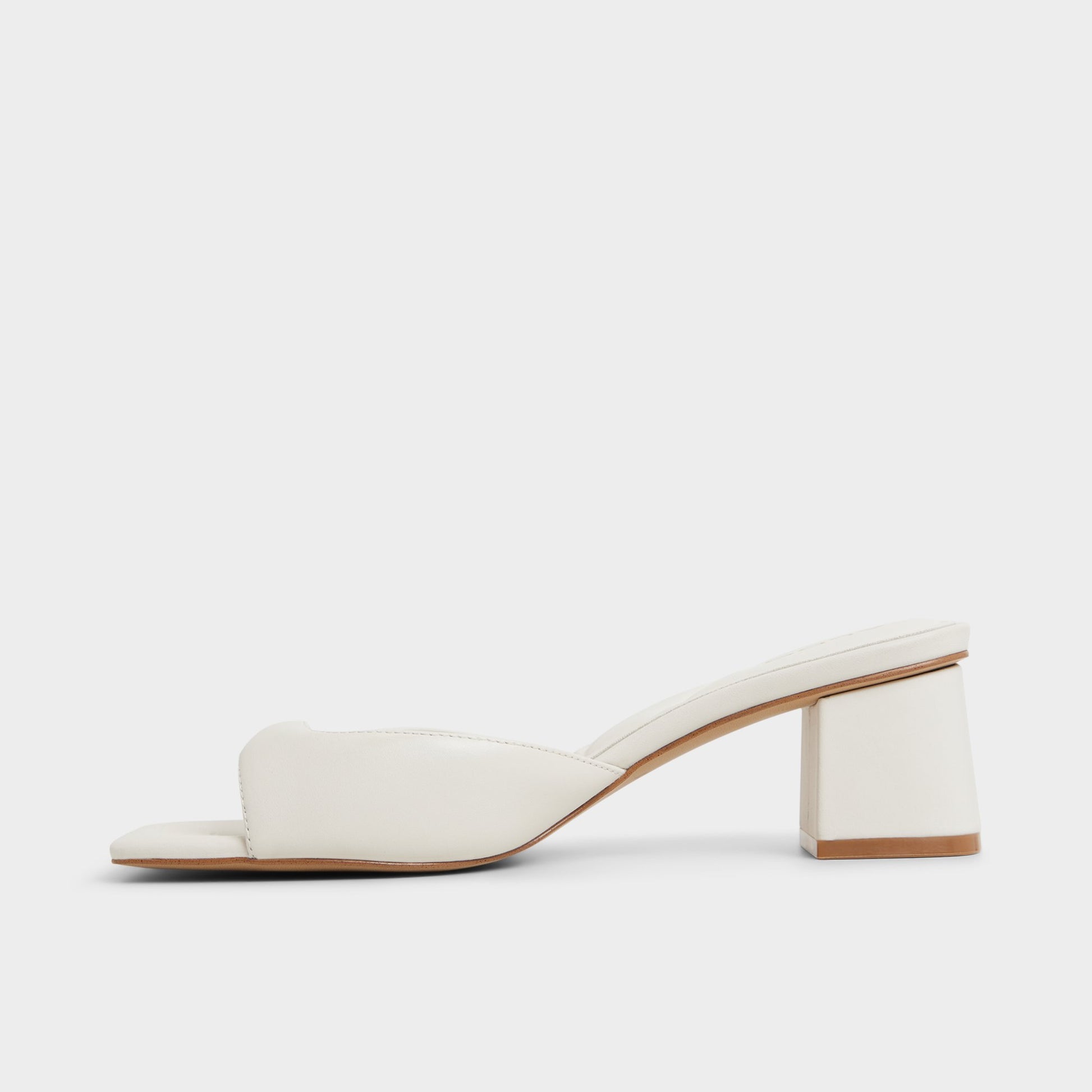 Side view of White/Bone Aneky Heeled mule