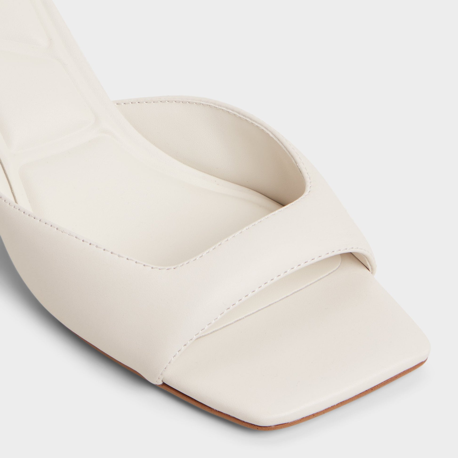 Close-up of the White/Bone Aneky Heeled mule