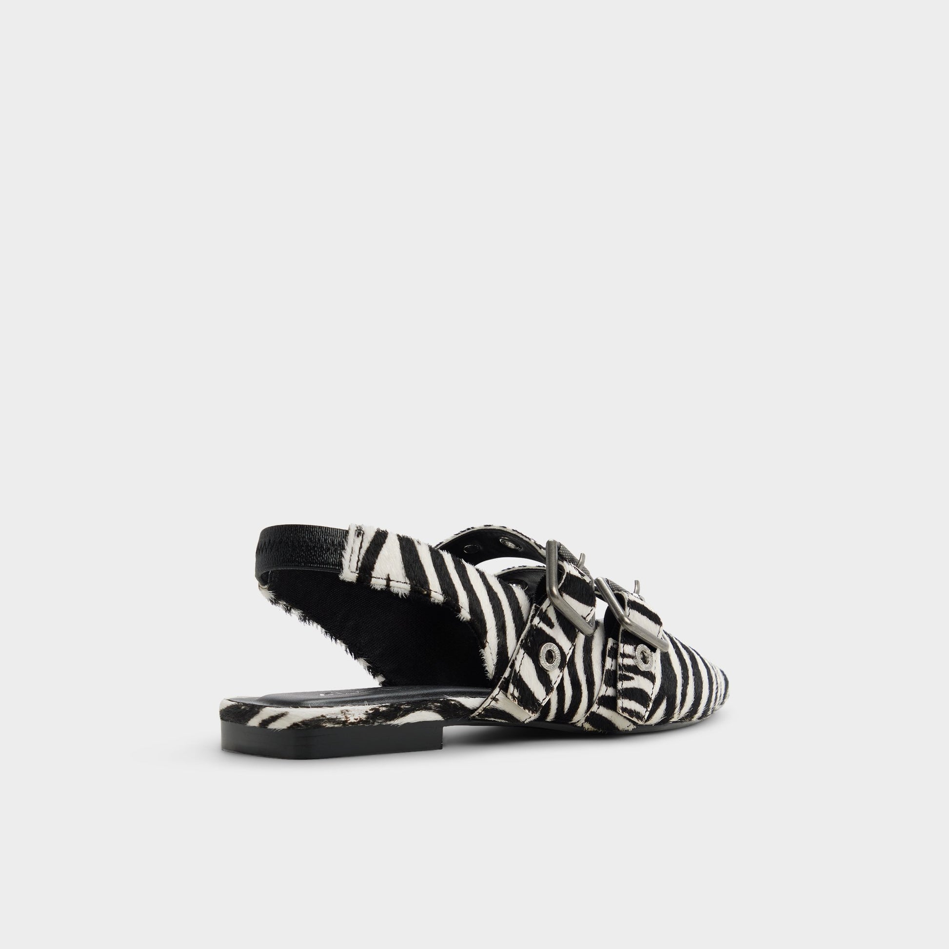 Three-quarter angle of White/Black Lotheillan Slingback ballerina's back side