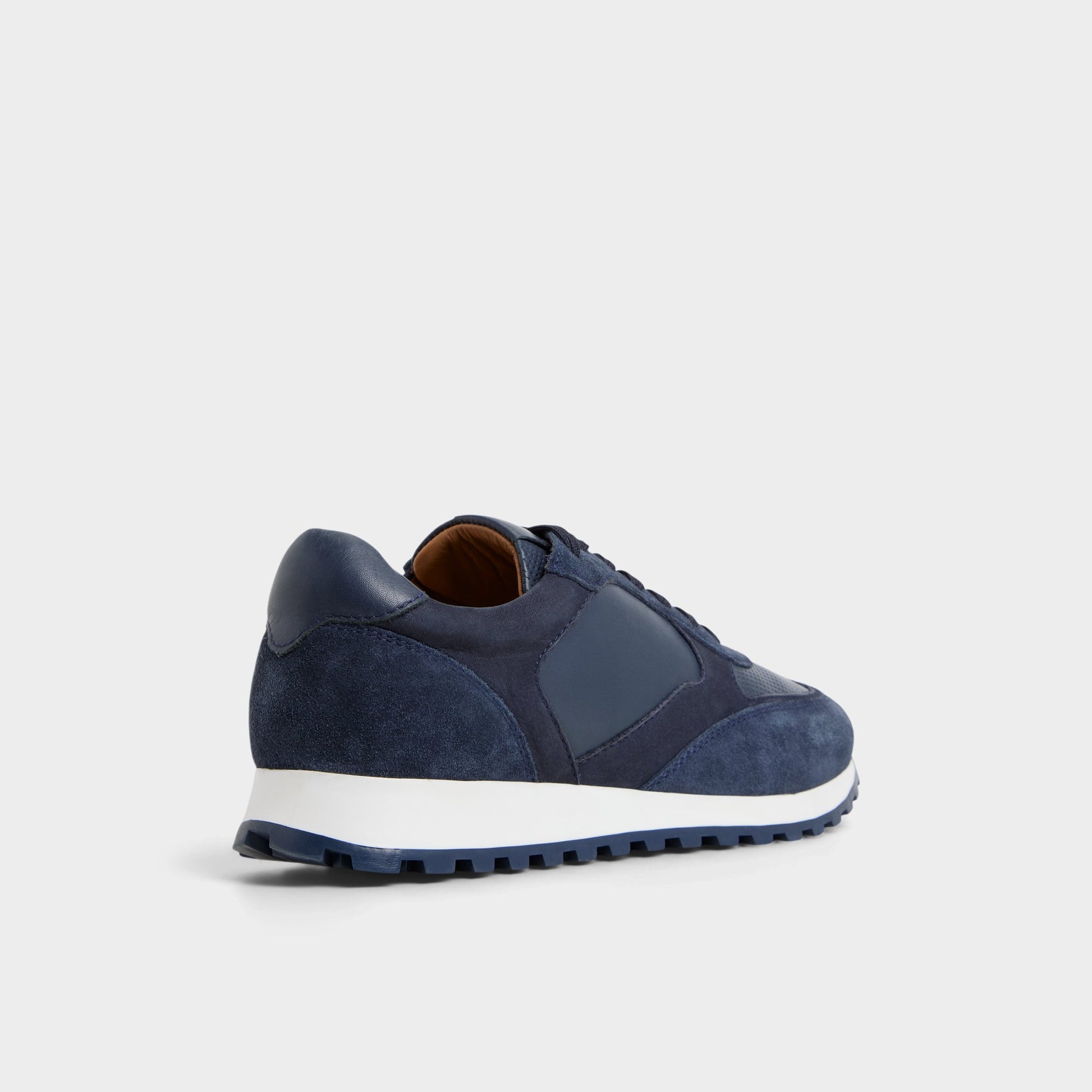 Three-quarter angle of Navy Gordo Low top sneaker's back side