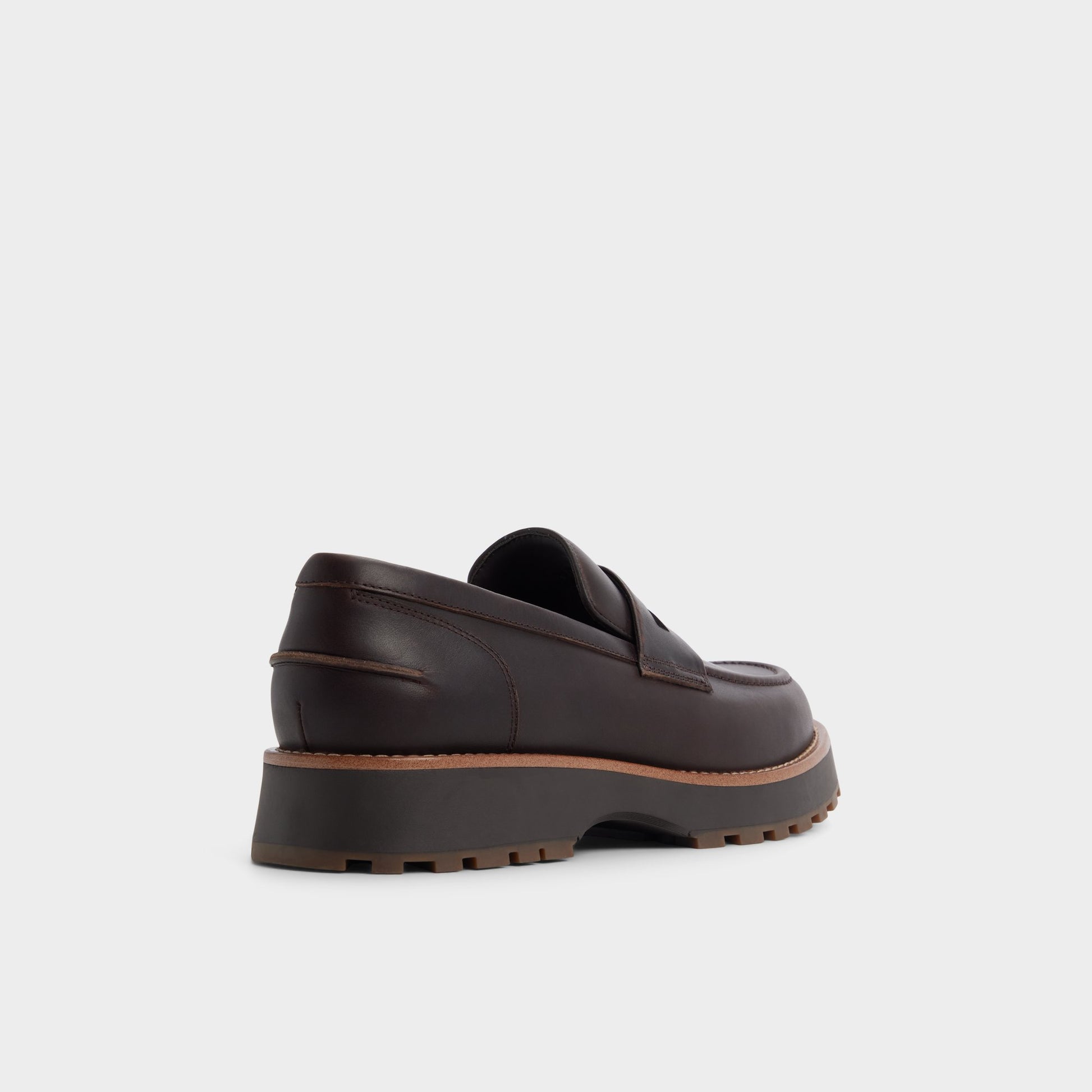 Three-quarter angle of Dark brown Kole Loafer's back side