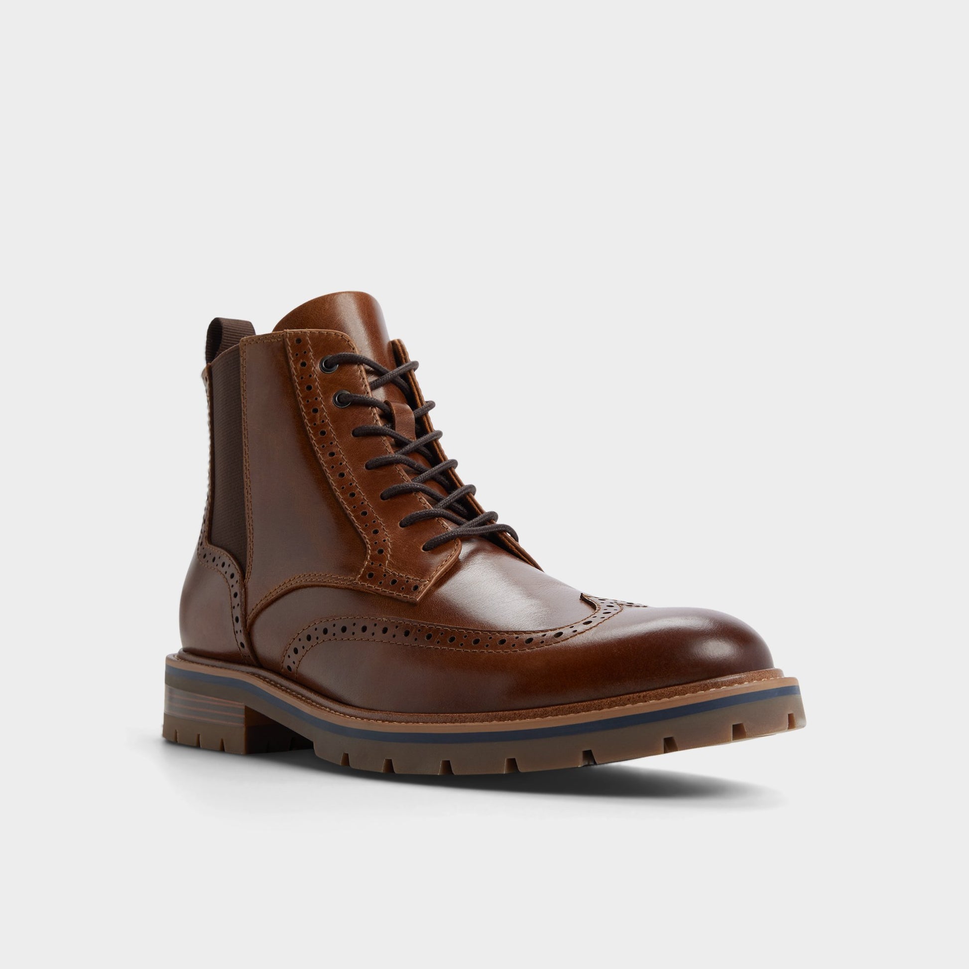 Three-quarter angle of Other Brown Toney Lace-up boot's front side