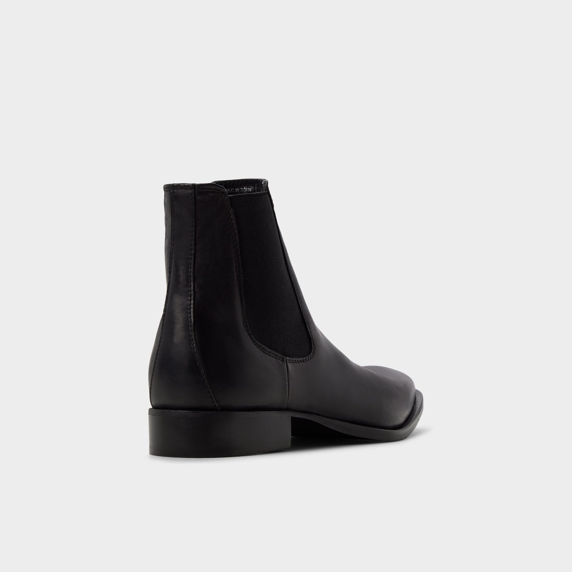 Three-quarter angle of Black Dax Chelsea boot's back side
