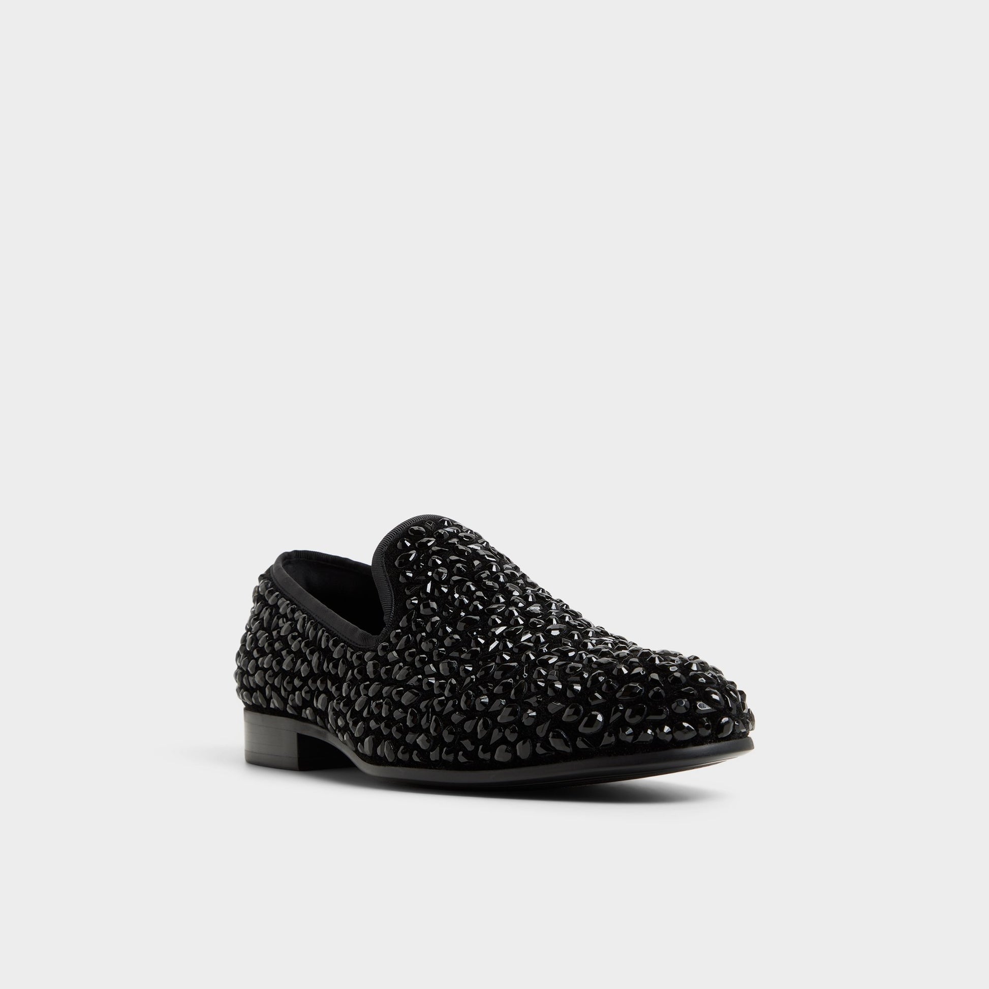 Three-quarter angle of Black Lux Slip-on's front side