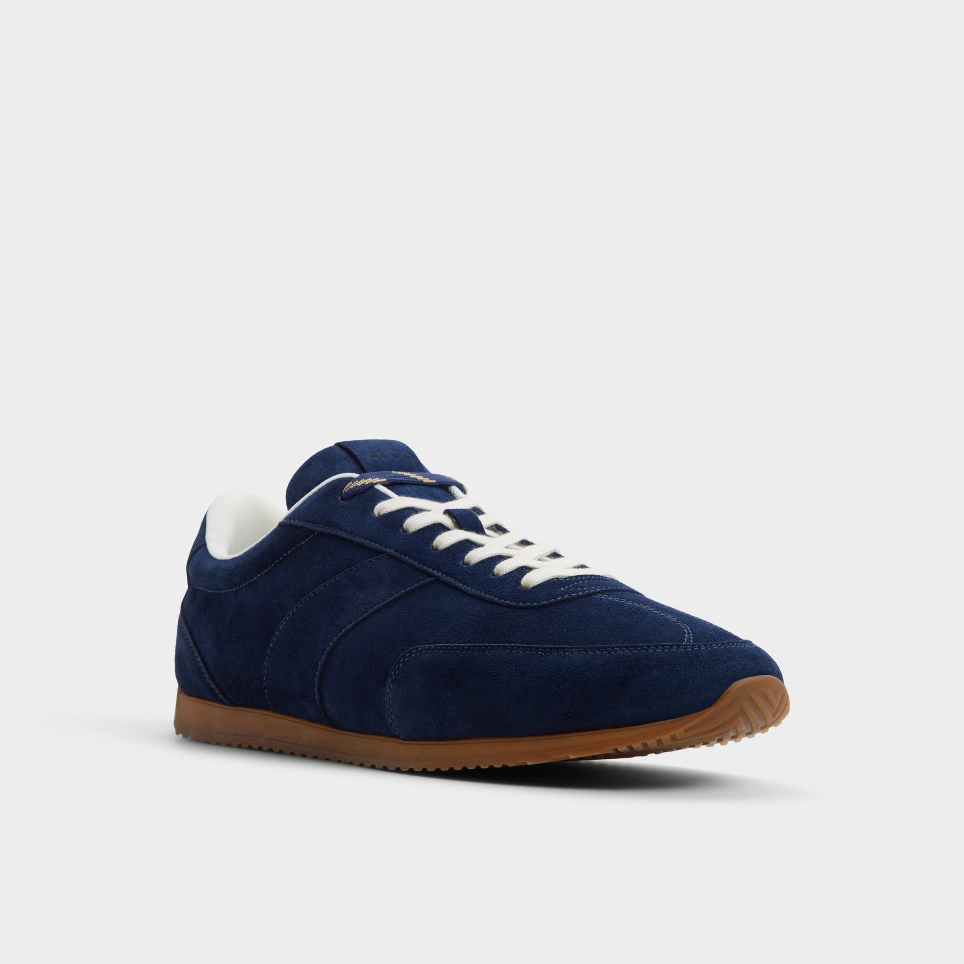 Three-quarter angle of Navy Nathaniel Low top sneaker's front side