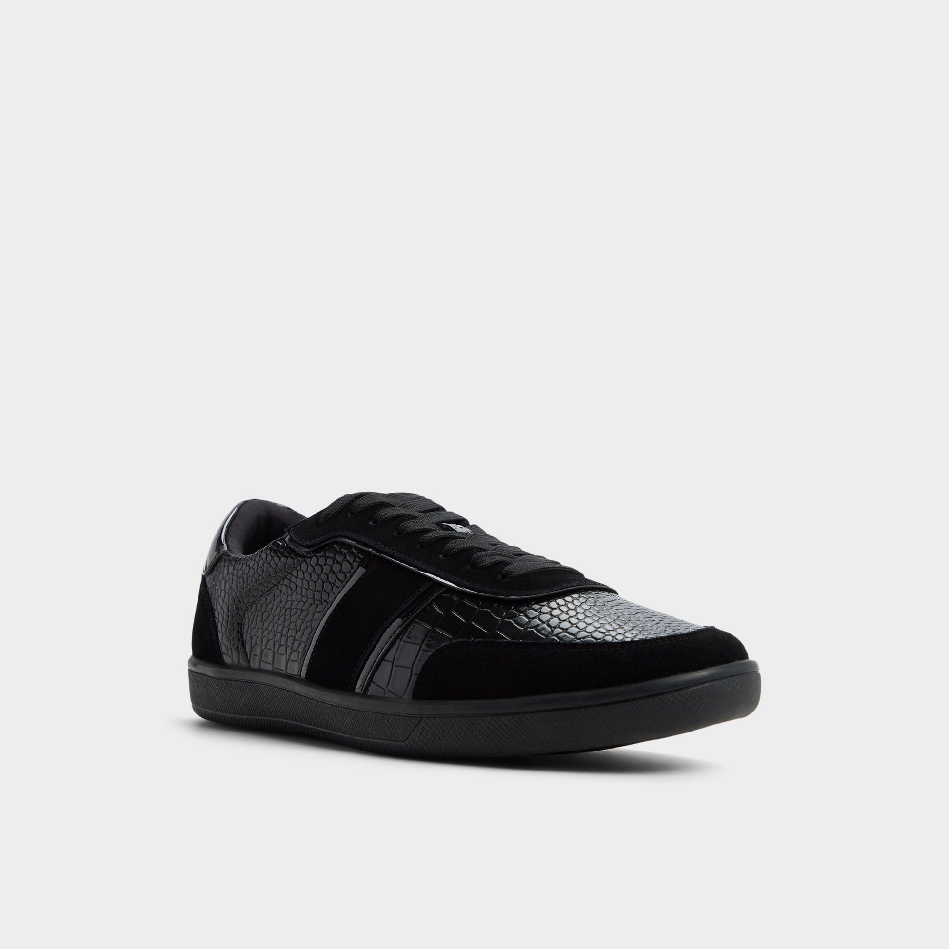 Three-quarter angle of Black Combo Uptown Low top sneaker's front side