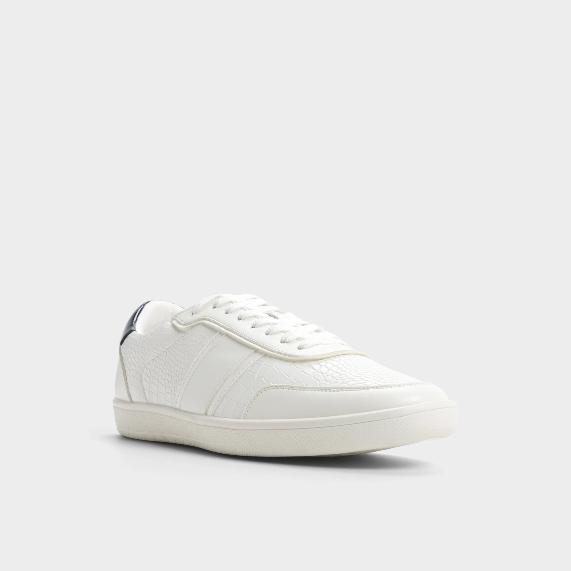 Three-quarter angle of White Combo Uptown Low top sneaker's front side