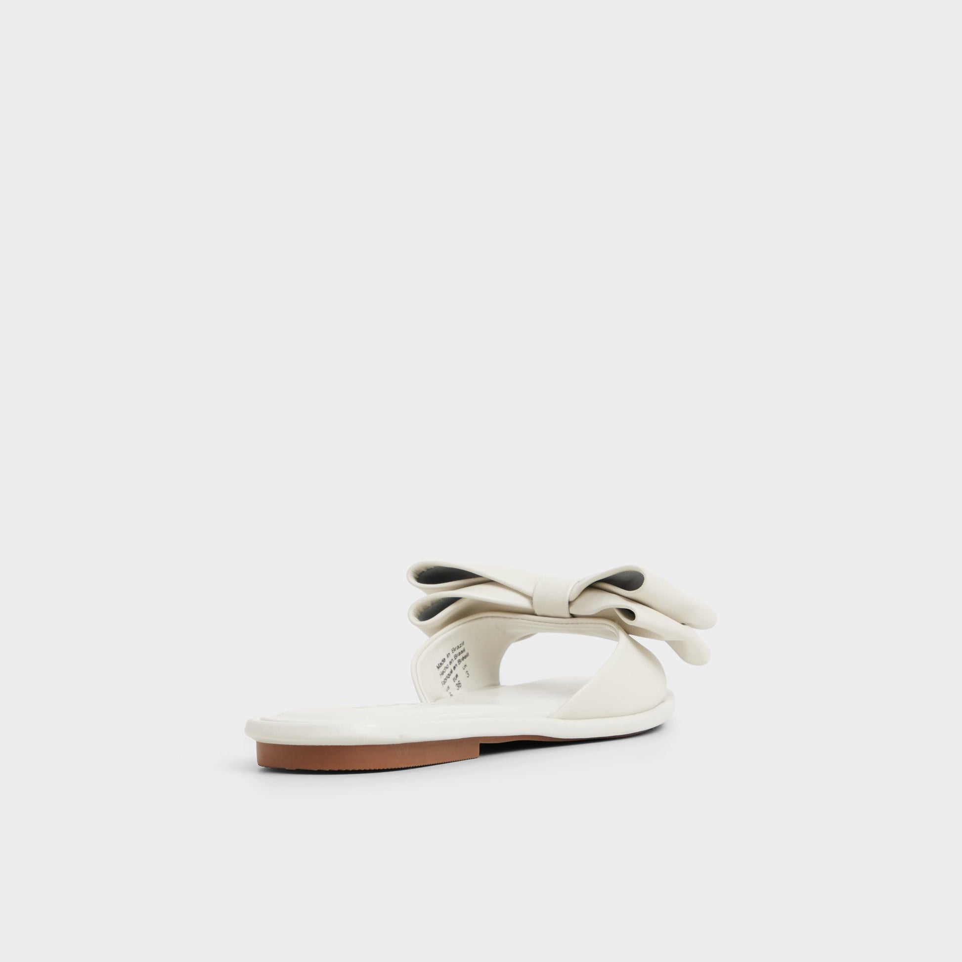 Three-quarter angle of Other White Bowetta Slide sandal's back side