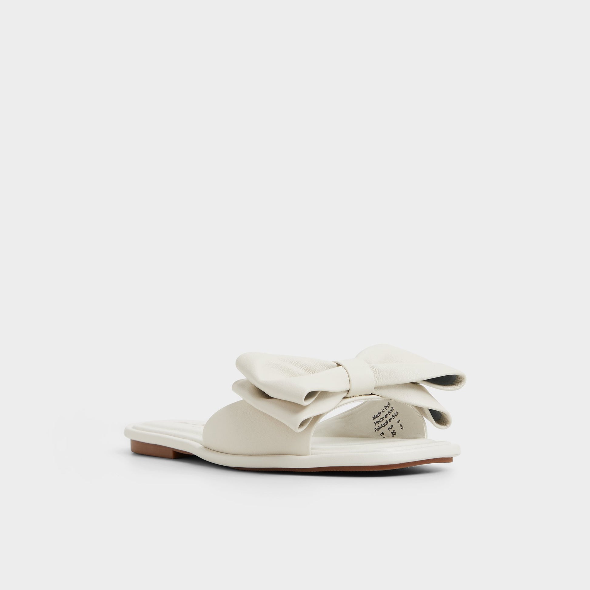 Three-quarter angle of Other White Bowetta Slide sandal's front side