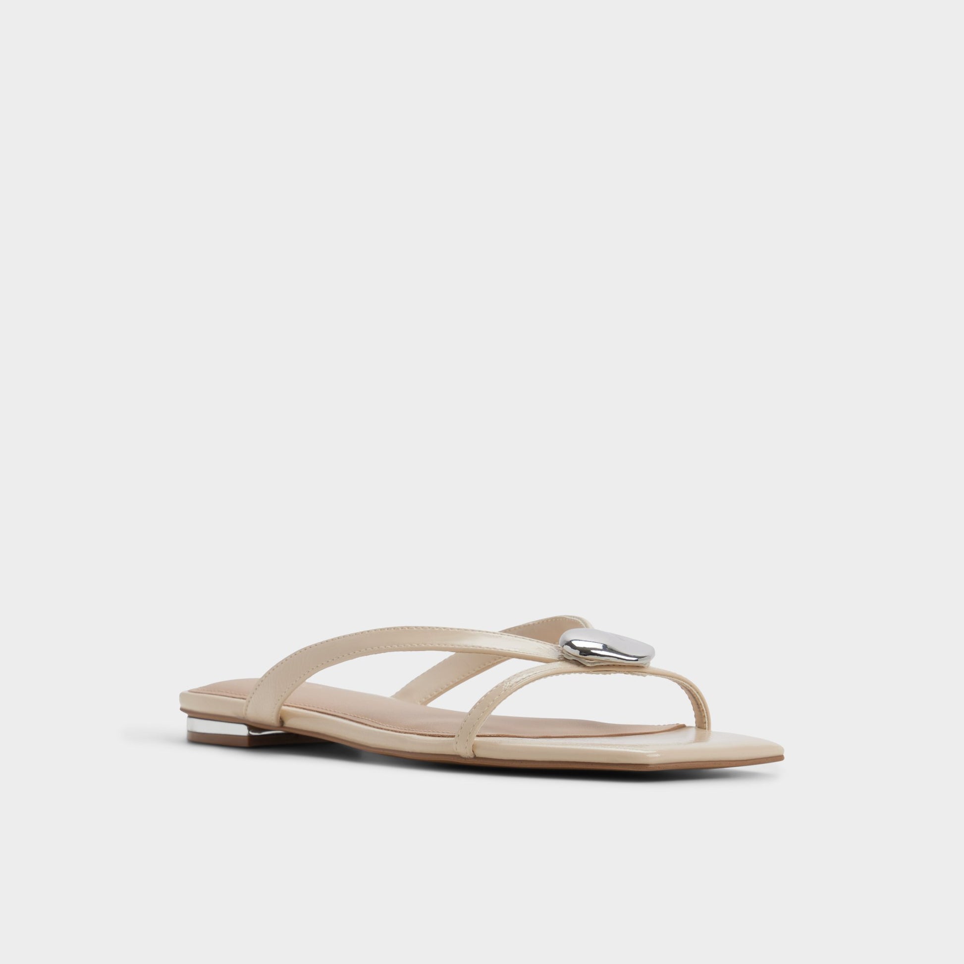 Three-quarter angle of Beige Iliria Slide sandal's front side