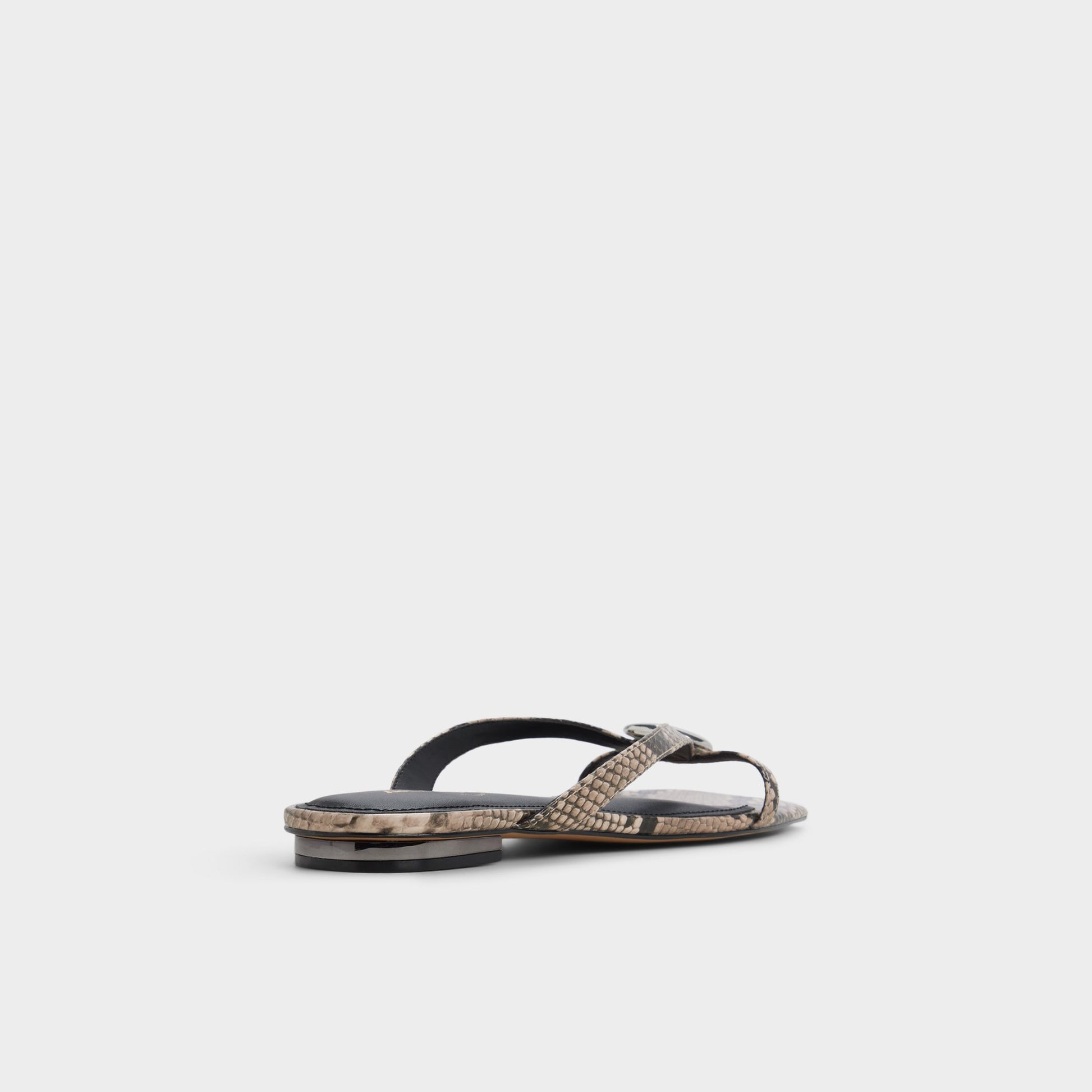Three-quarter angle of White/black Iliria Slide sandal's back side