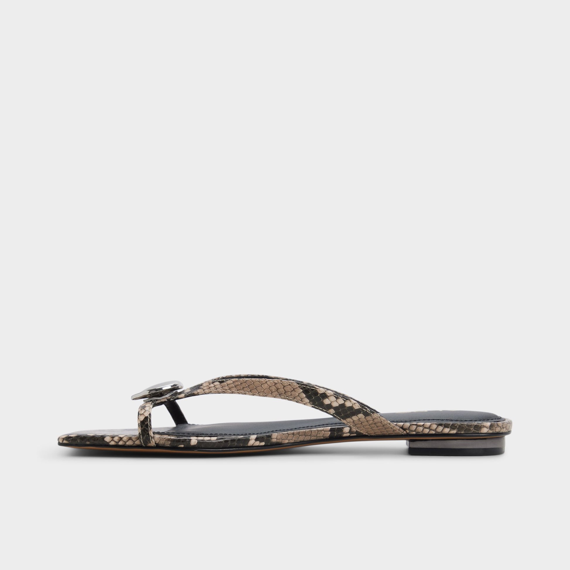 Side view of White/black Iliria Slide sandal