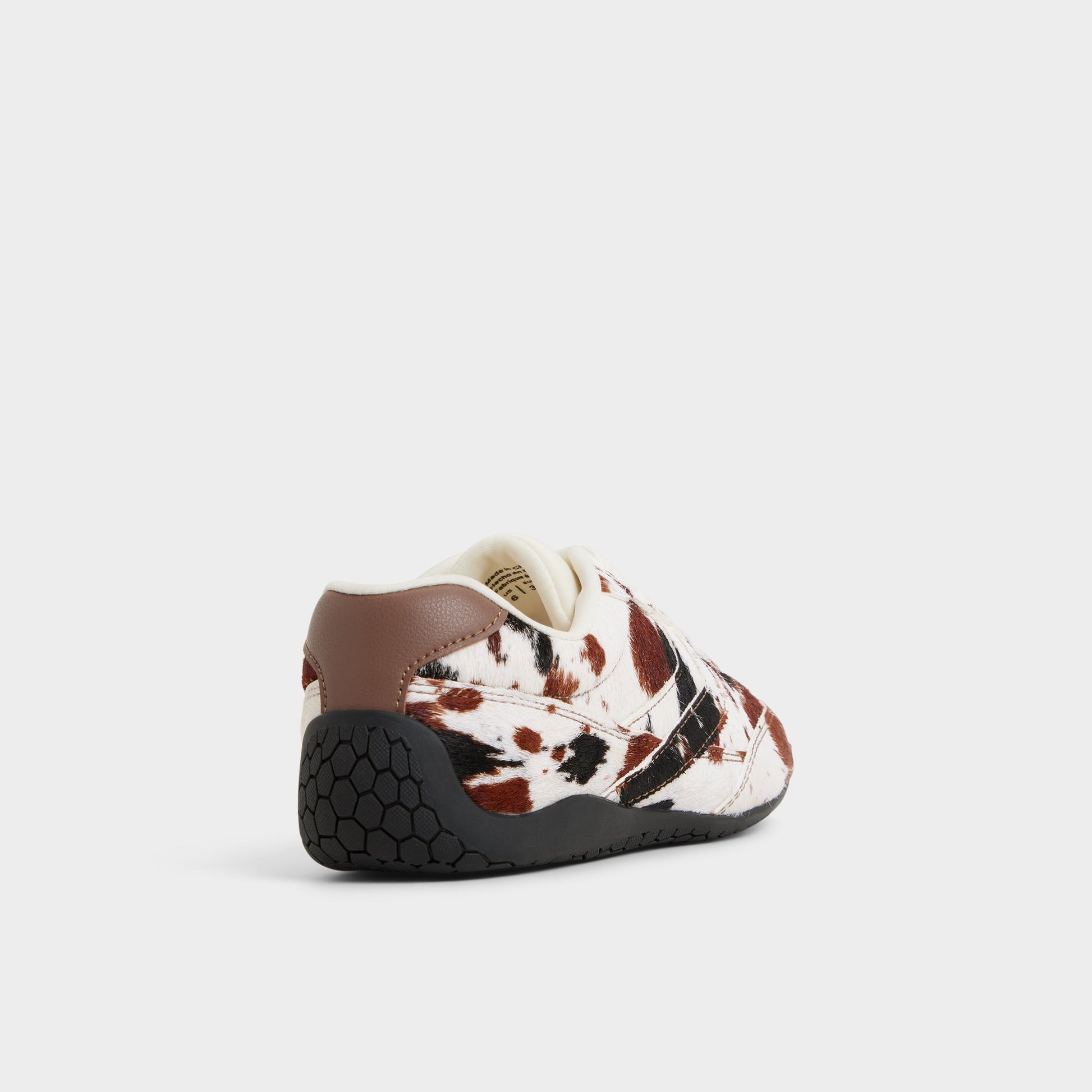 Three-quarter angle of White Combo Coolchic Jogger sneaker's back side