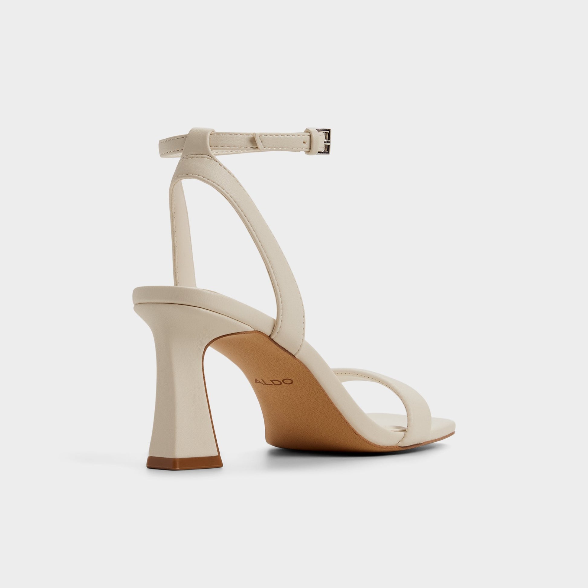 Three-quarter angle of White/bone Austorai Strappy heeled sandal's back side