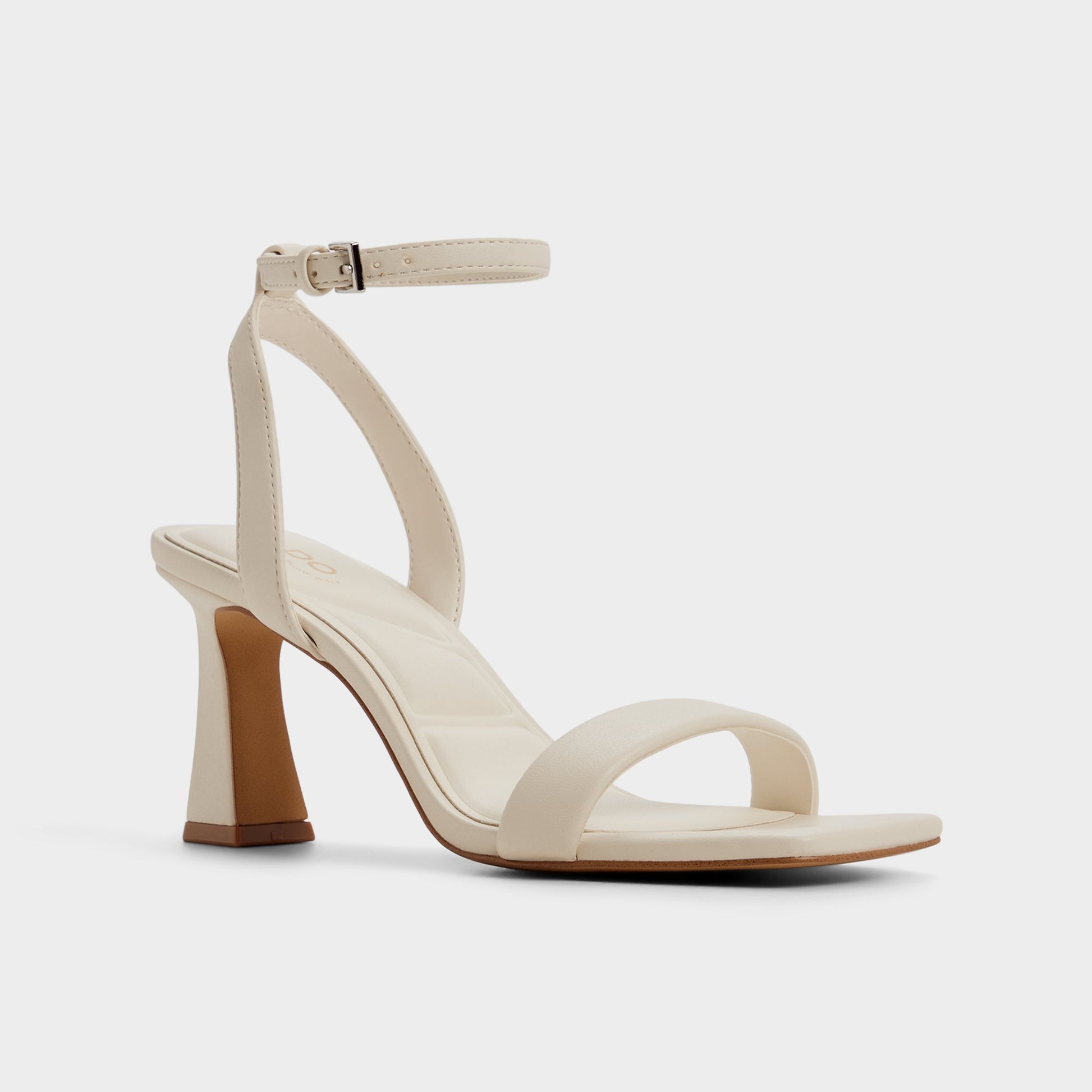 Three-quarter angle of White/bone Austorai Strappy heeled sandal's front side