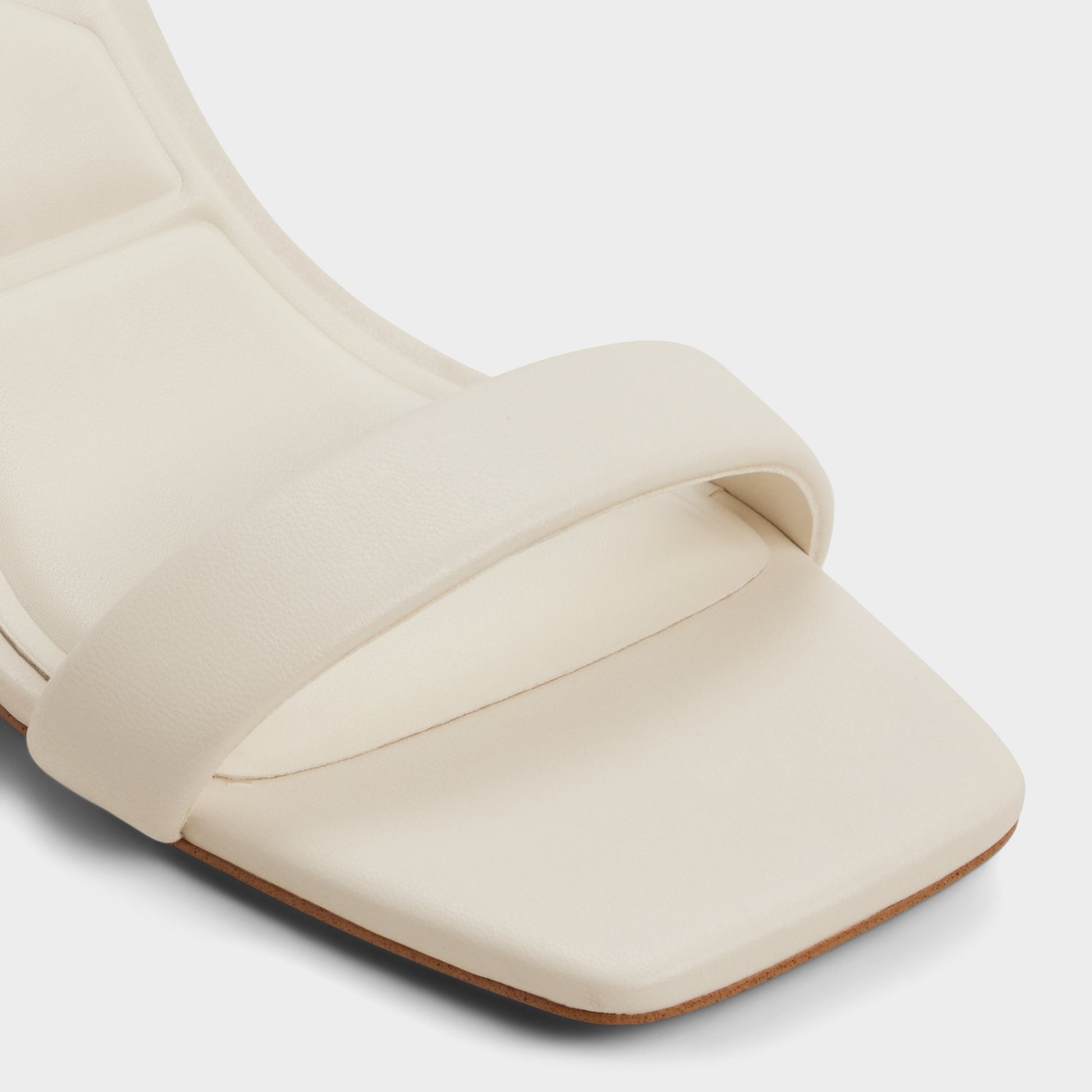 Close-up of the White/bone Austorai Strappy heeled sandal