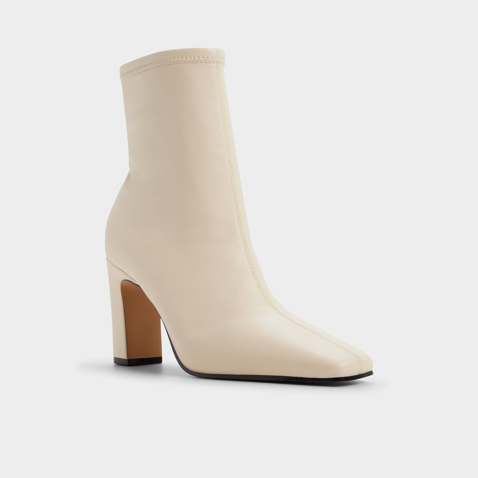 Three-quarter angle of Cream Cybele Ankle boot's front side