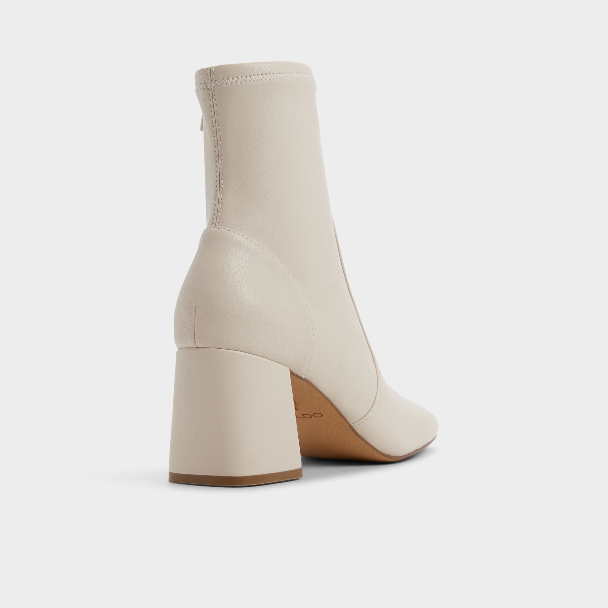 Three-quarter angle of White/Bone Indigo Ankle boot's back side