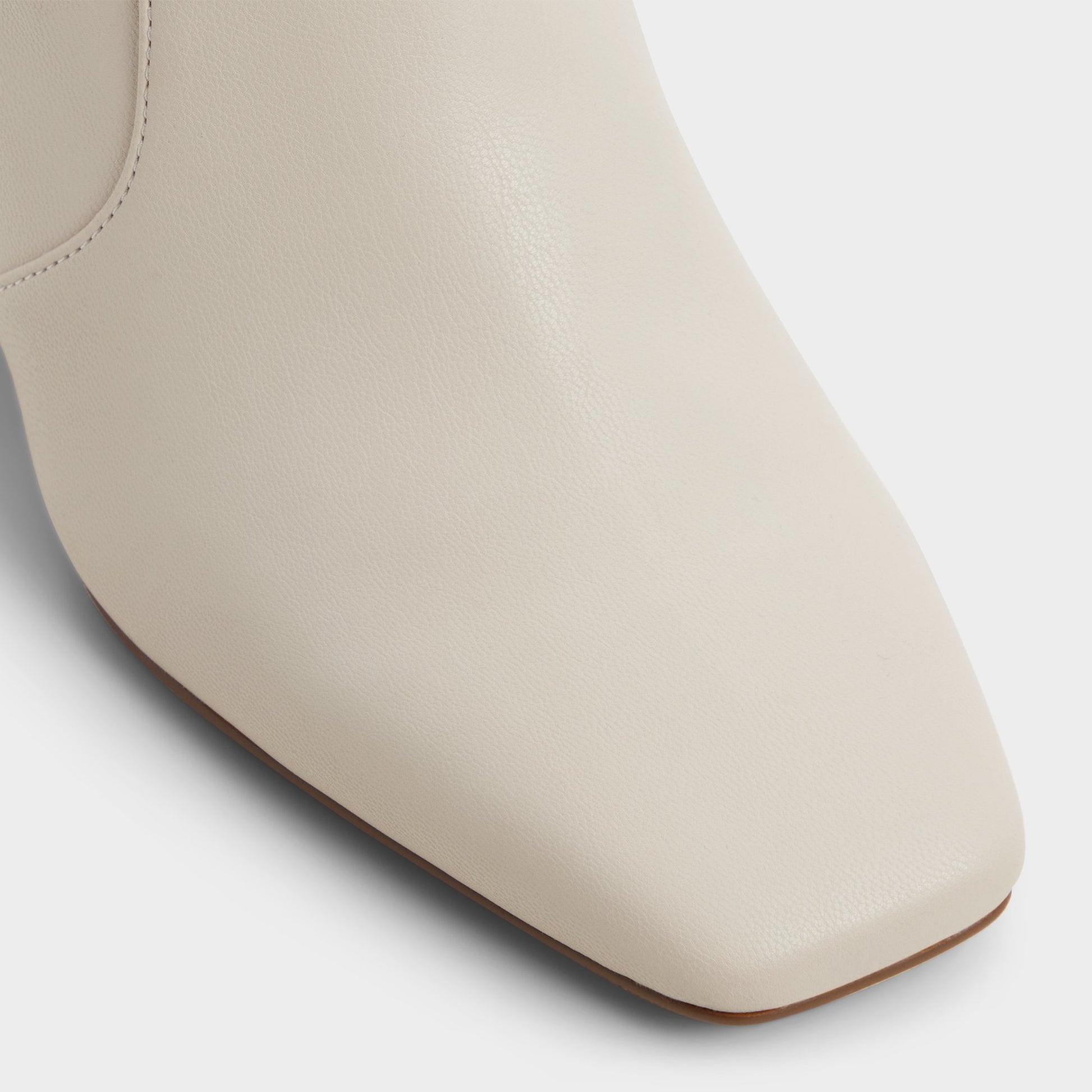 Close-up of the White/Bone Indigo Ankle boot