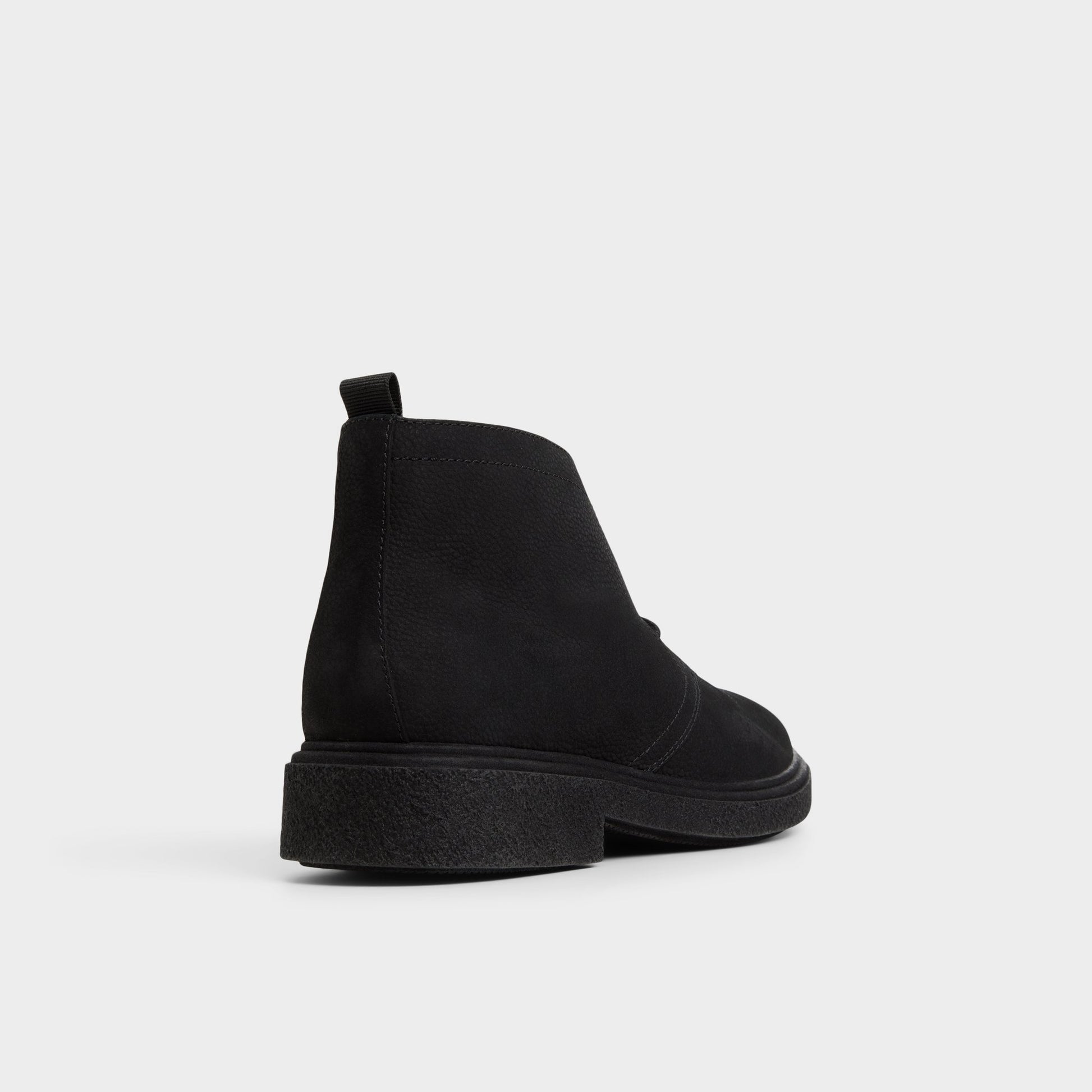 Three-quarter angle of Black Torroo Chukka boot's back side