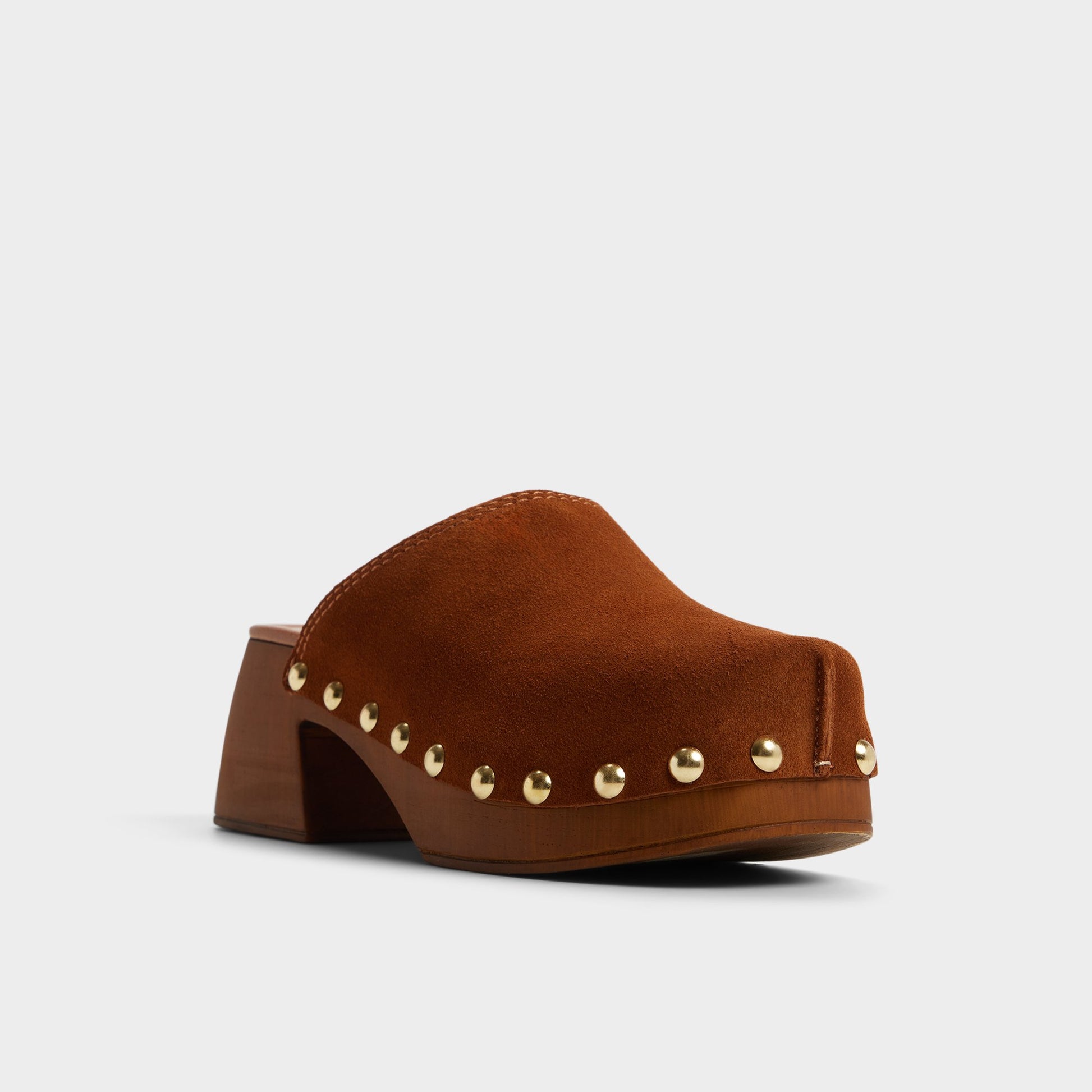 Three-quarter angle of Tan Tayloria Clog's front side