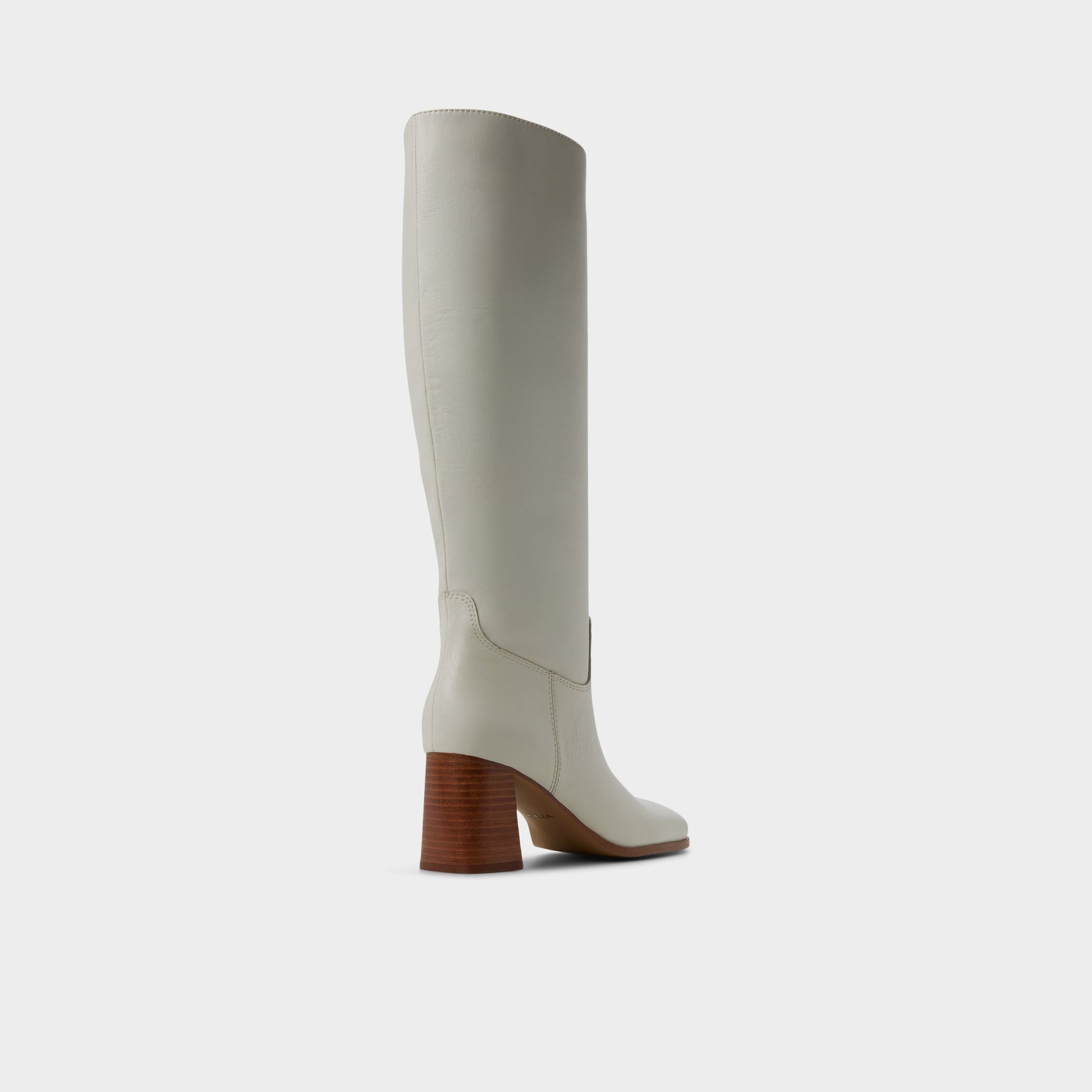 Three-quarter angle of White/bone Elyze Knee-high boot's back side