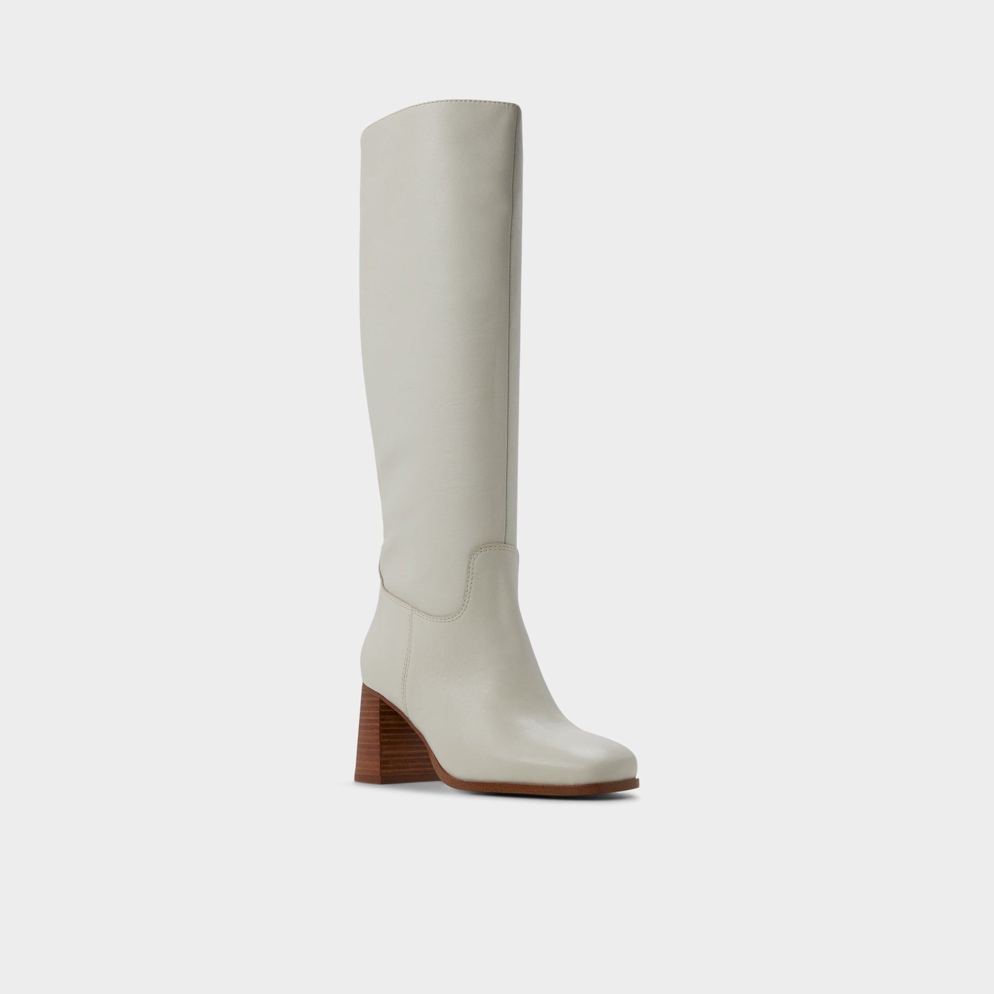 Three-quarter angle of White/bone Elyze Knee-high boot's front side