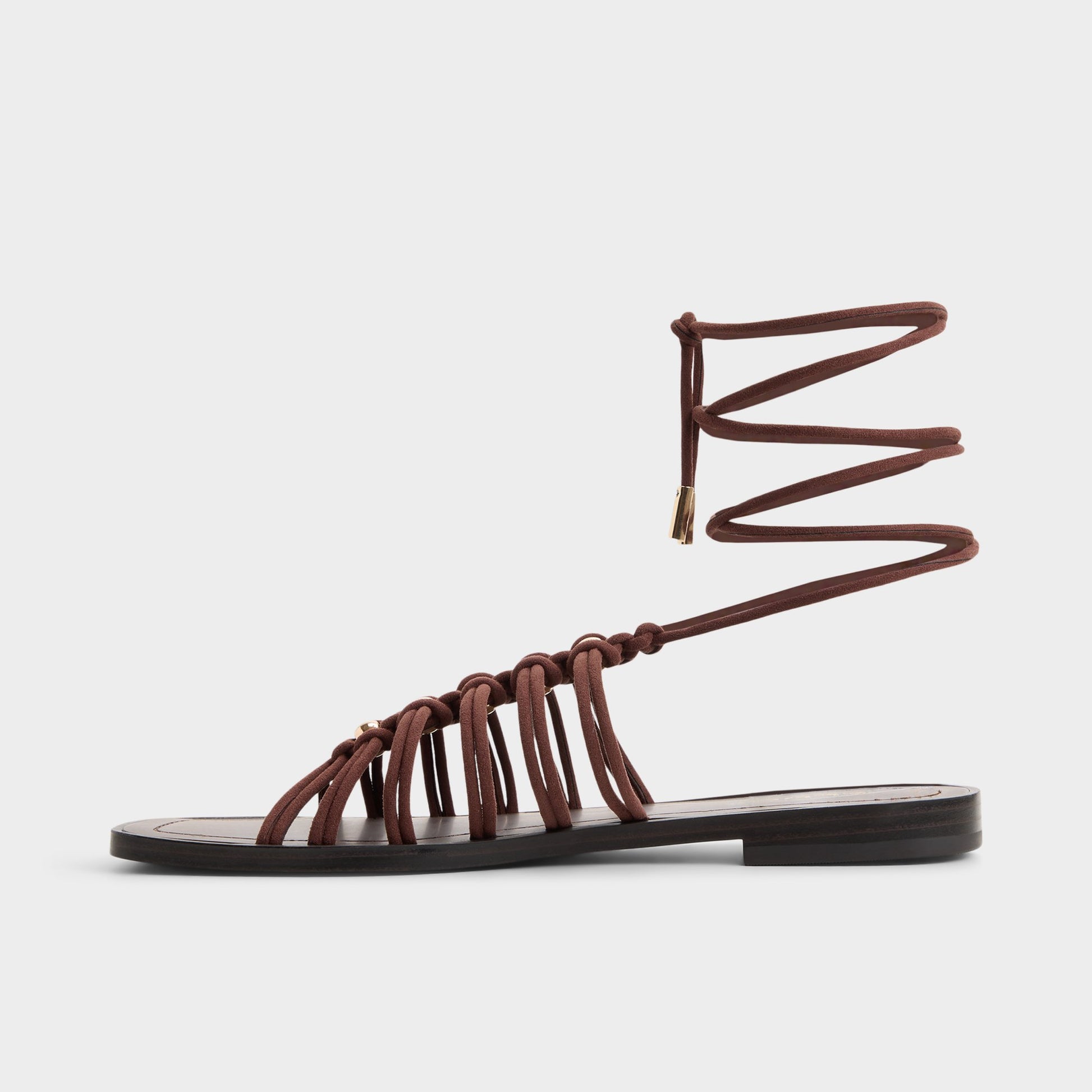 Side view of Dark brown Unoma Strappy flat sandal