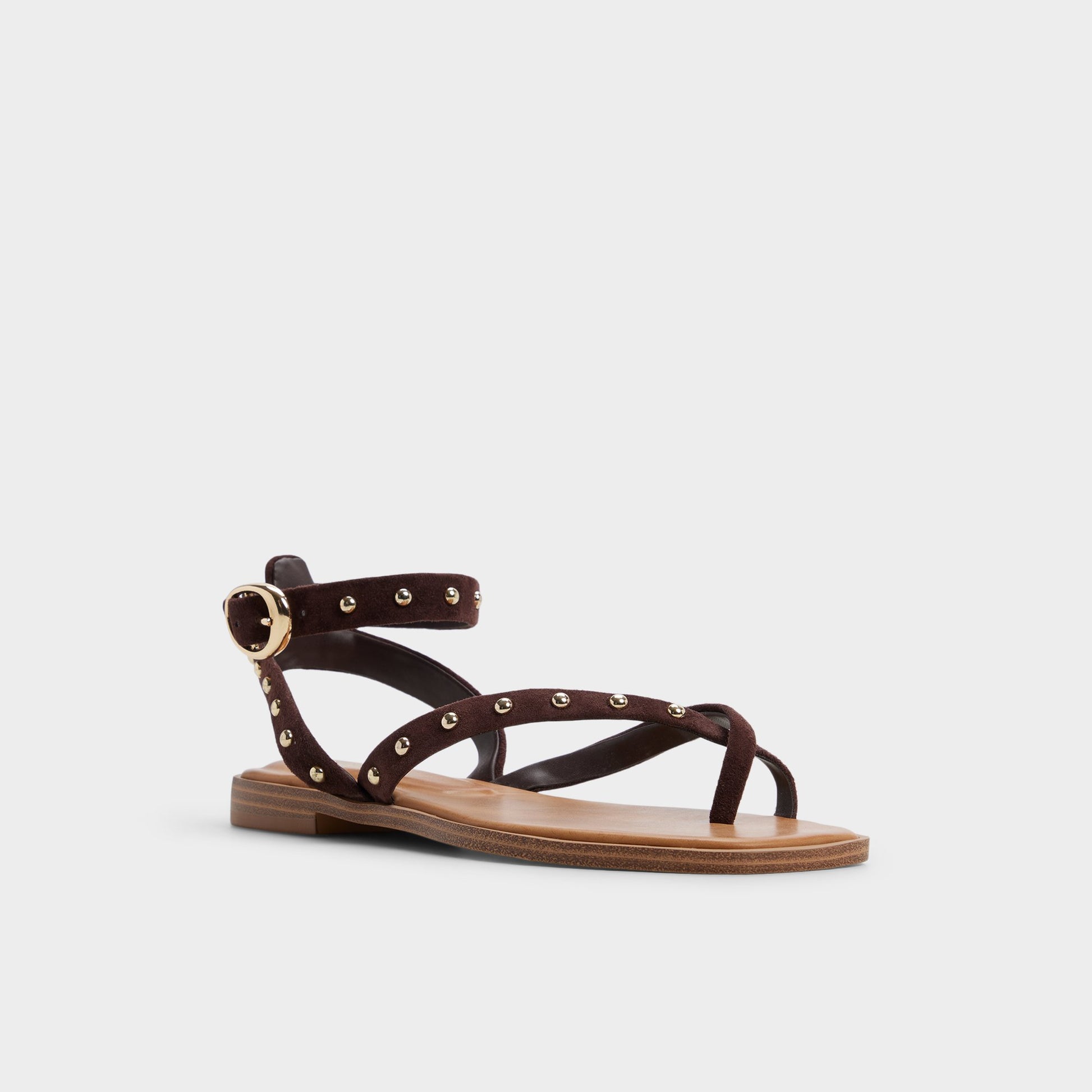 Three-quarter angle of Dark brown Daressi Flat sandal's front side