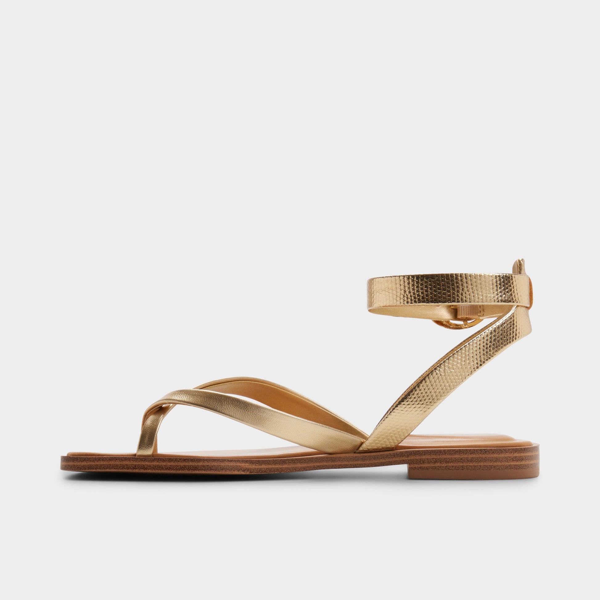 Side view of Gold Daressi Flat sandal