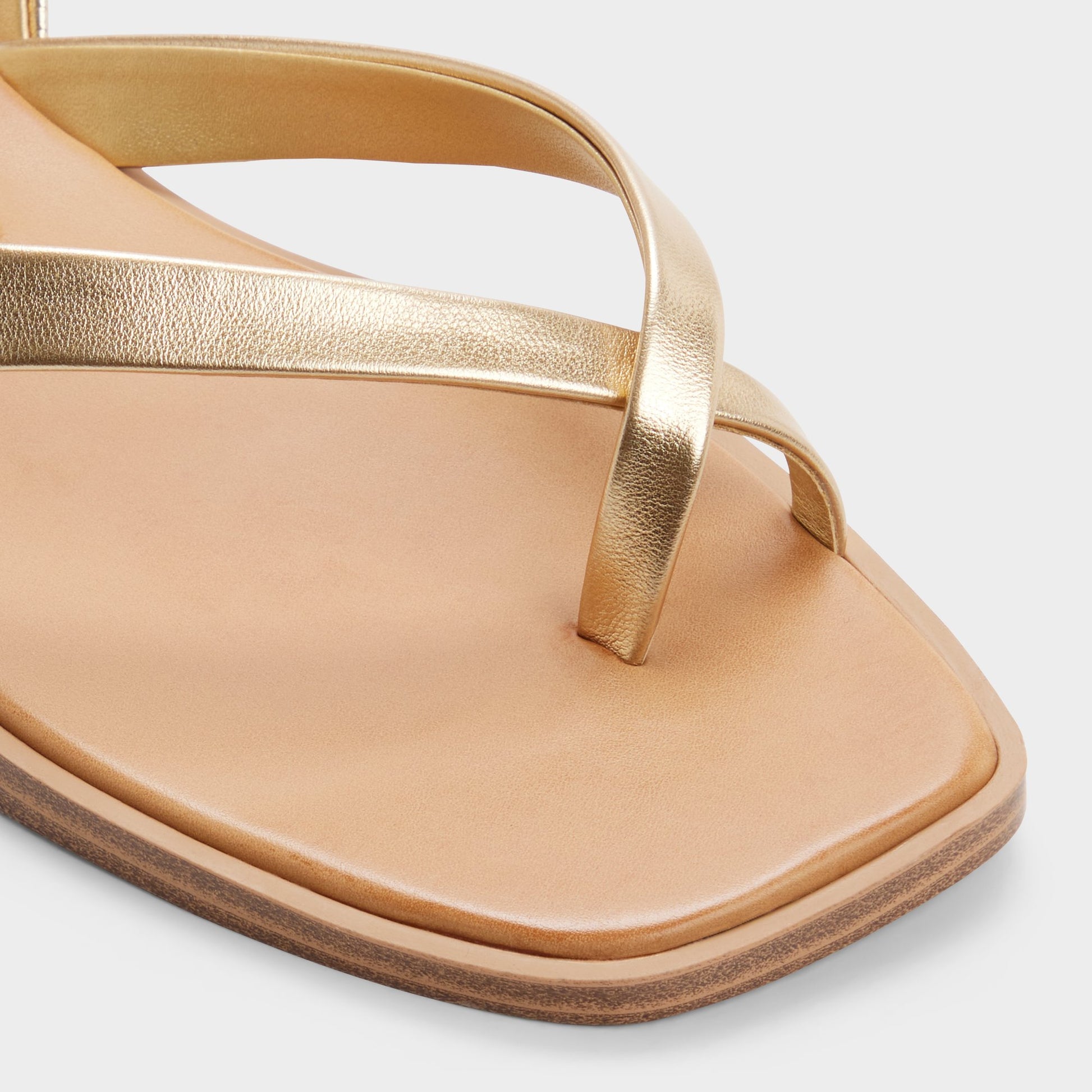 Close-up of the Gold Daressi Flat sandal