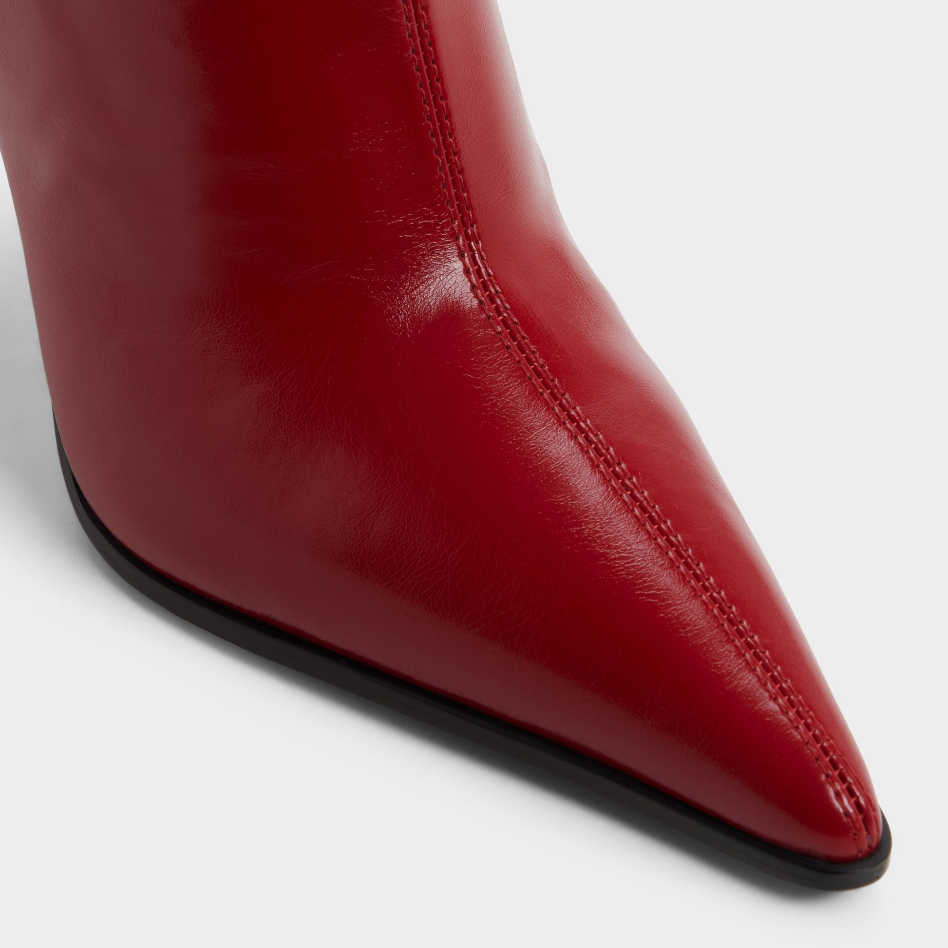 Close-up of the Medium red Re-emily Knee-high boot