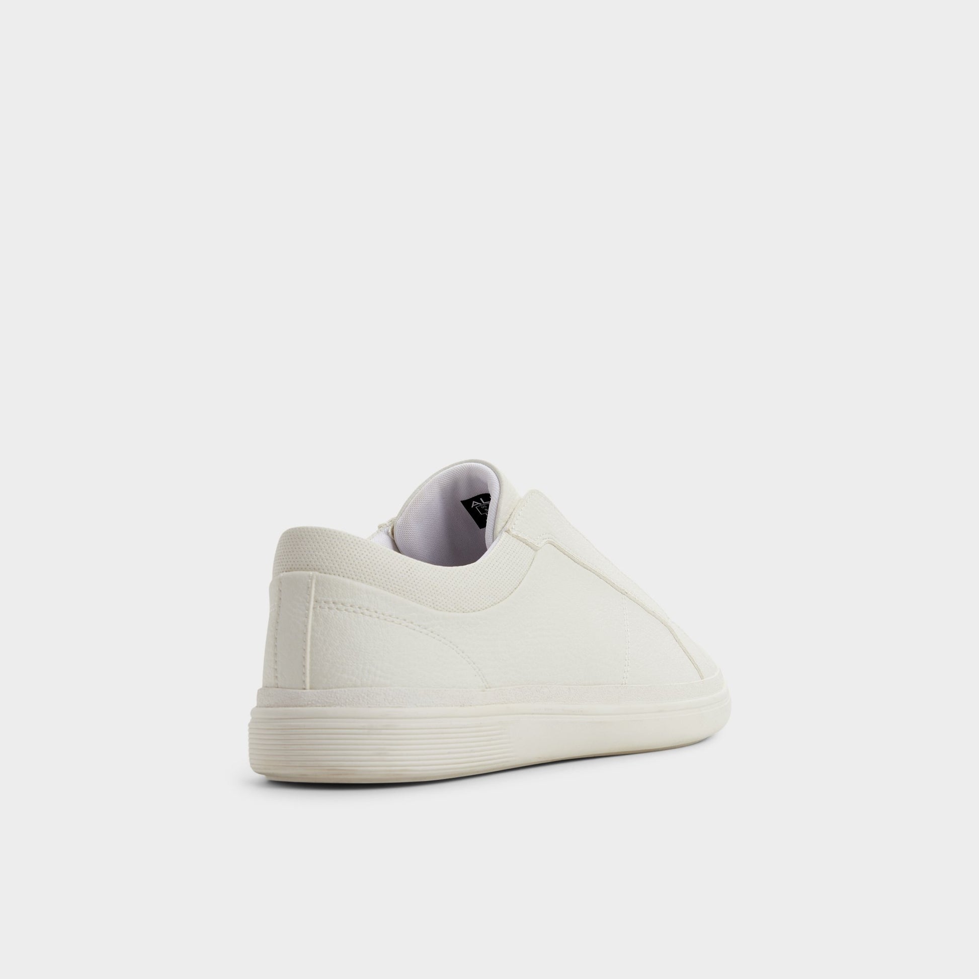 Three-quarter angle of White Carlson Slip-on sneaker's back side