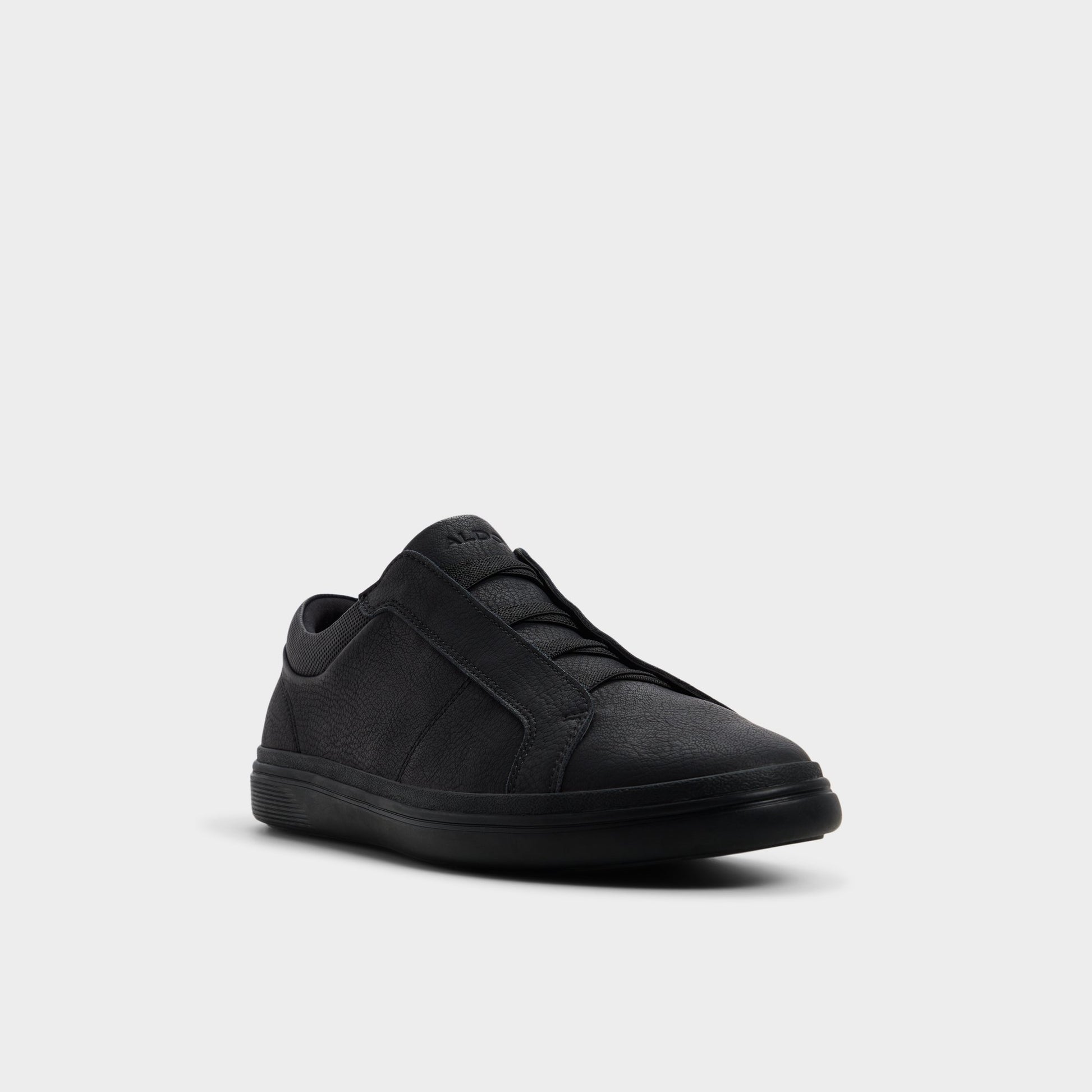 Three-quarter angle of Black Carlson Slip-on sneaker's front side