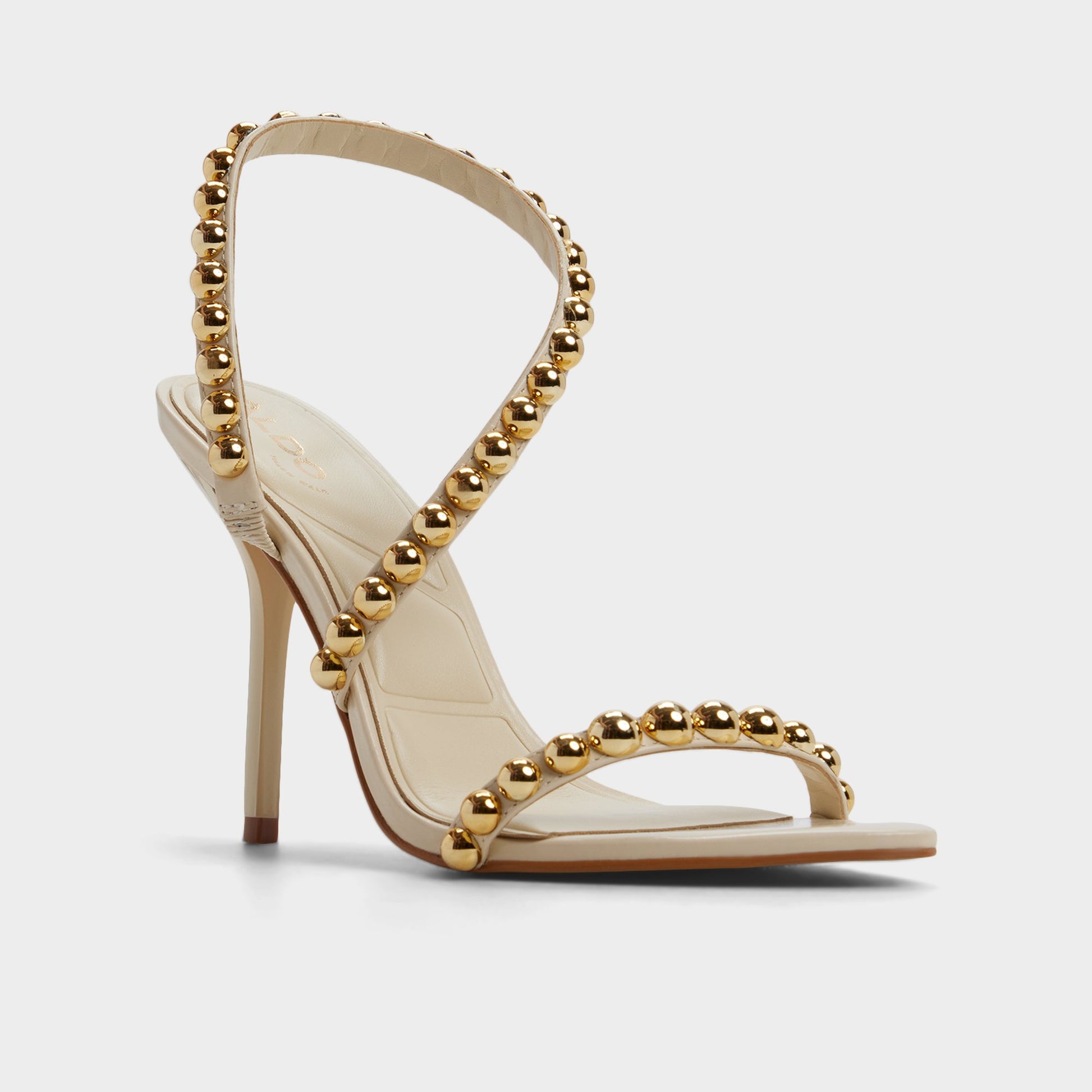 Three-quarter angle of Cream Attey Strappy heeled sandal's front side