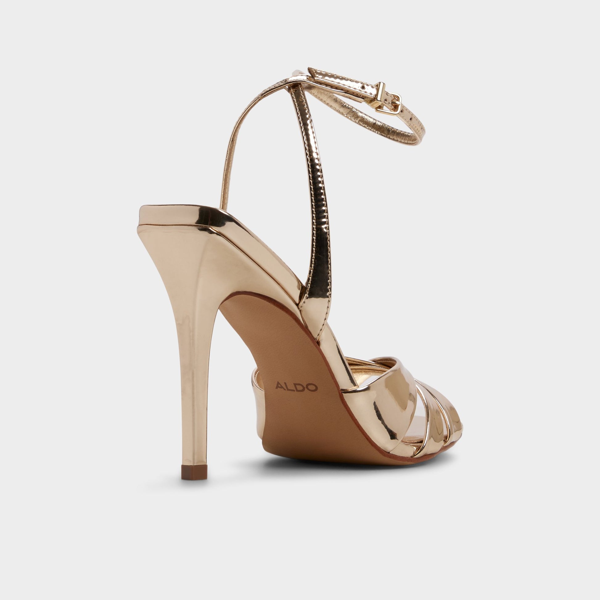 Three-quarter angle of Gold Meteora Strappy heeled sandal's back side