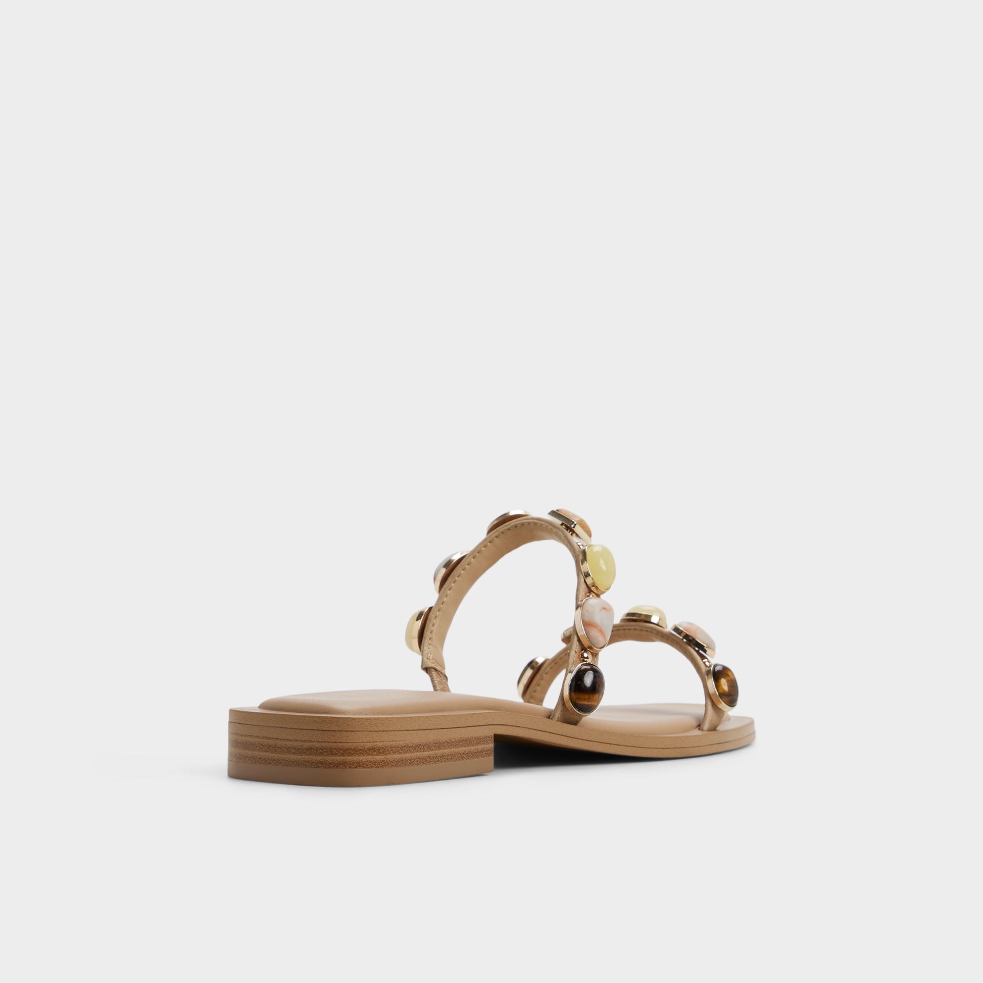 Three-quarter angle of Medium beige Sapphira Slide sandal's back side