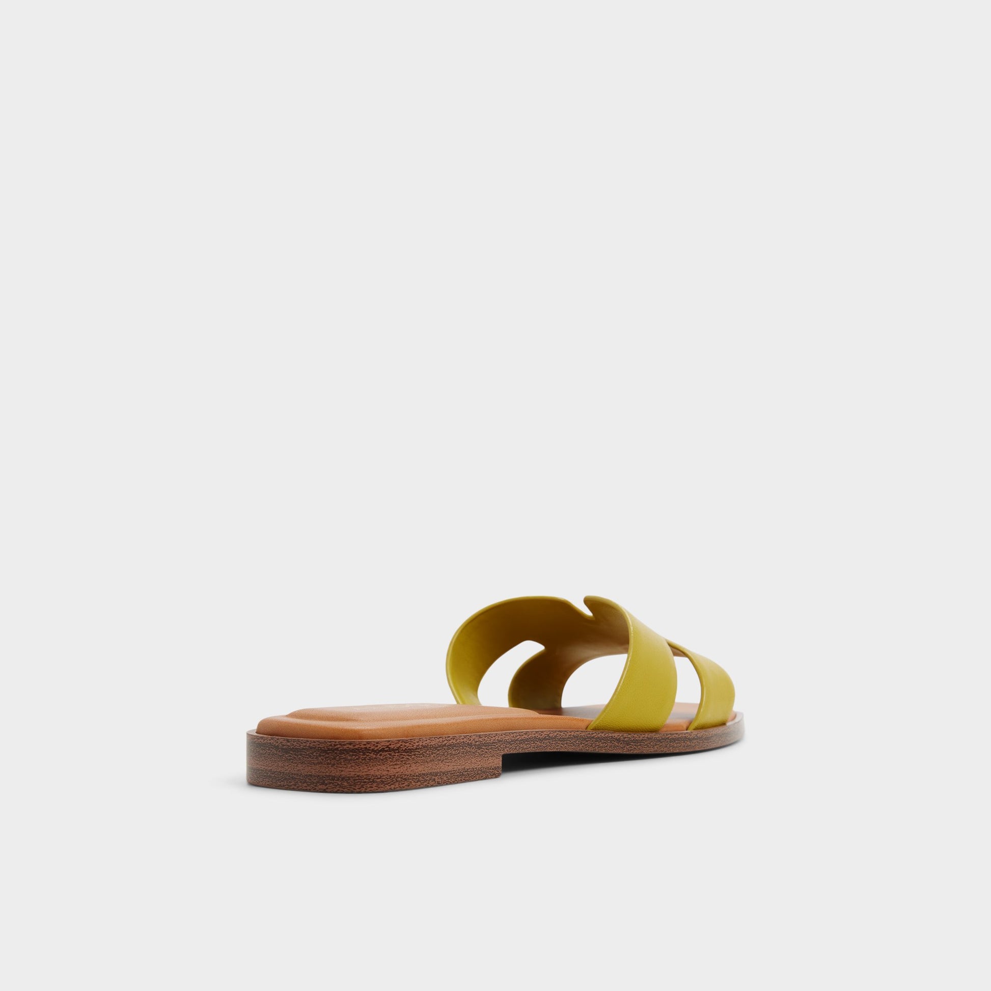 Three-quarter angle of Other yellow Itsandal Slide sandal's back side