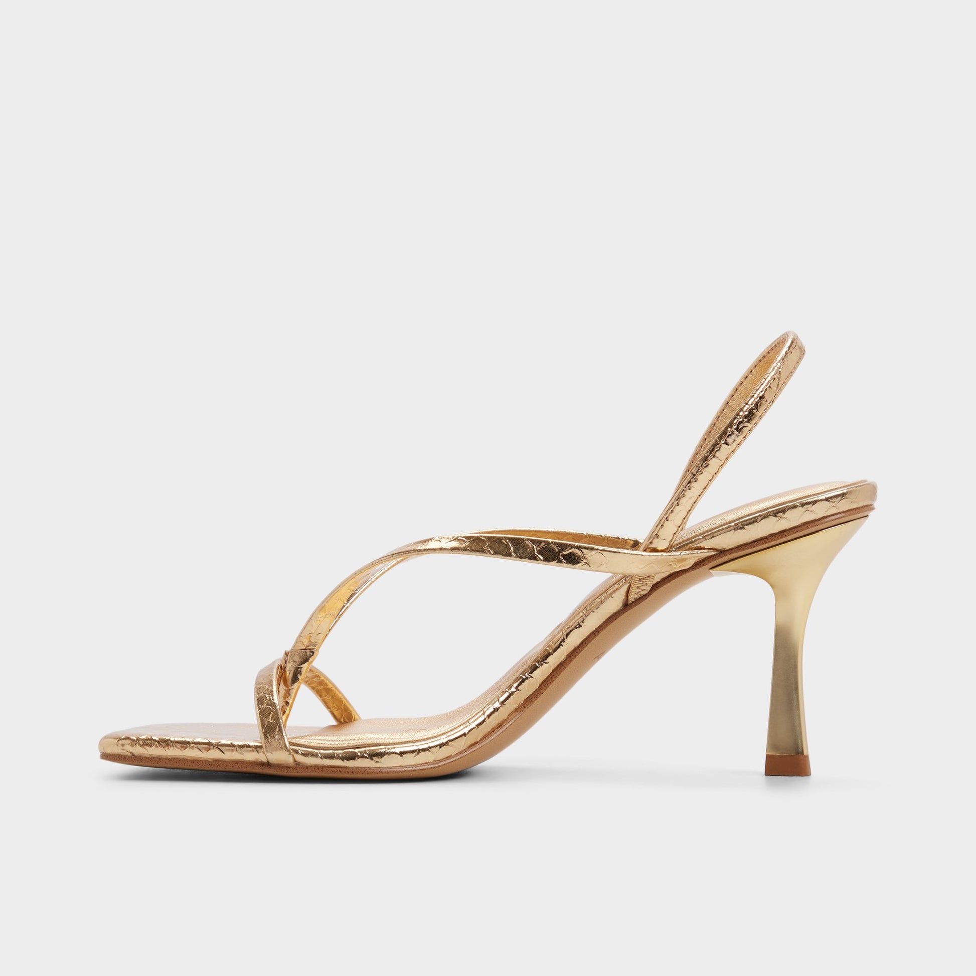 Side view of Gold Riva Sling back heeled sandal