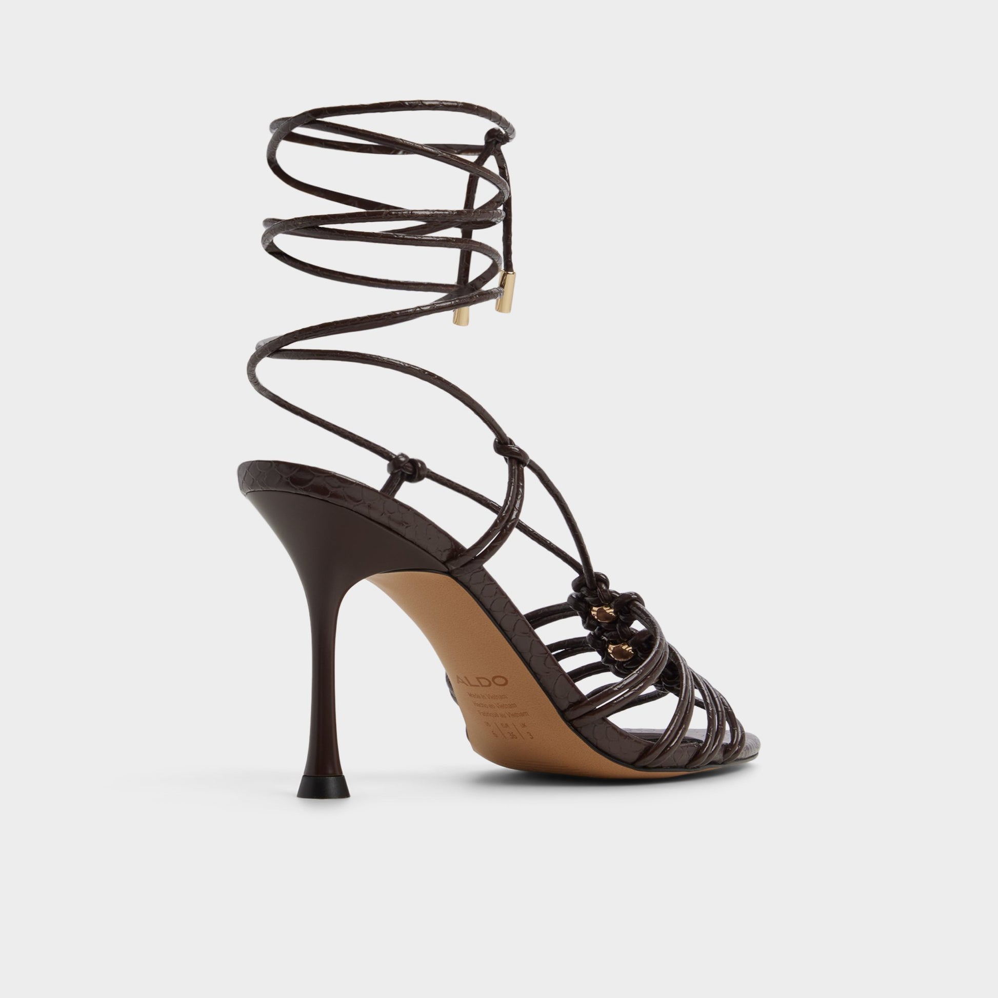 Three-quarter angle of Dark brown Curacao Strappy heeled sandal's back side