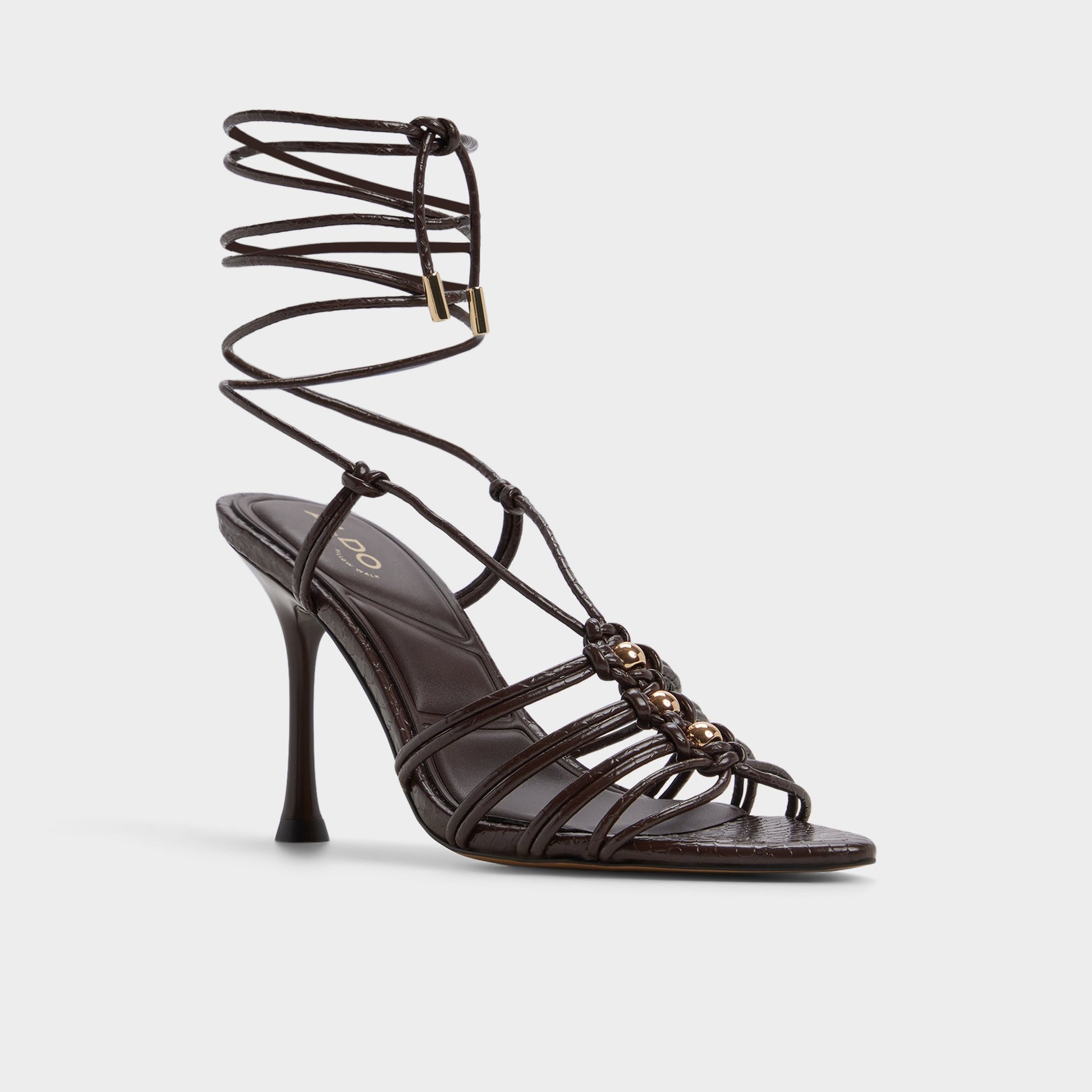 Three-quarter angle of Dark brown Curacao Strappy heeled sandal's front side